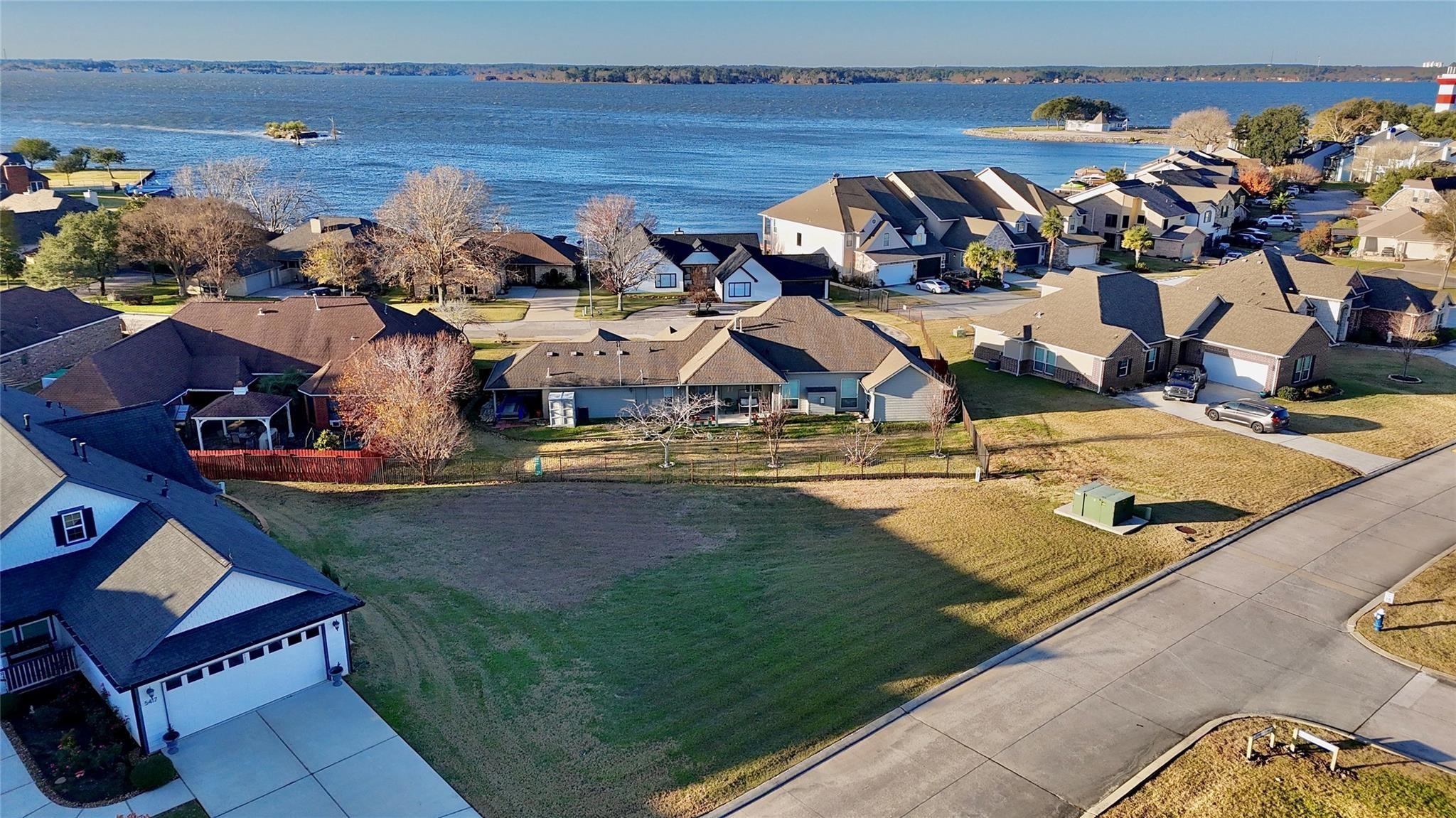 Image 2: Overhead view showing the lot&rsquo;s shape, grassy surf