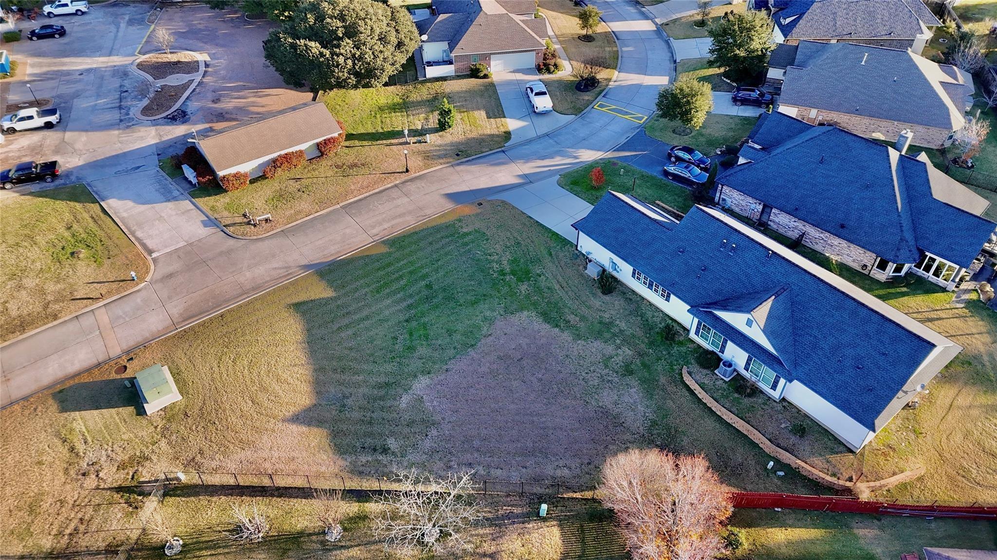 Image 4: Elevated neighborhood view showing the vacant parc