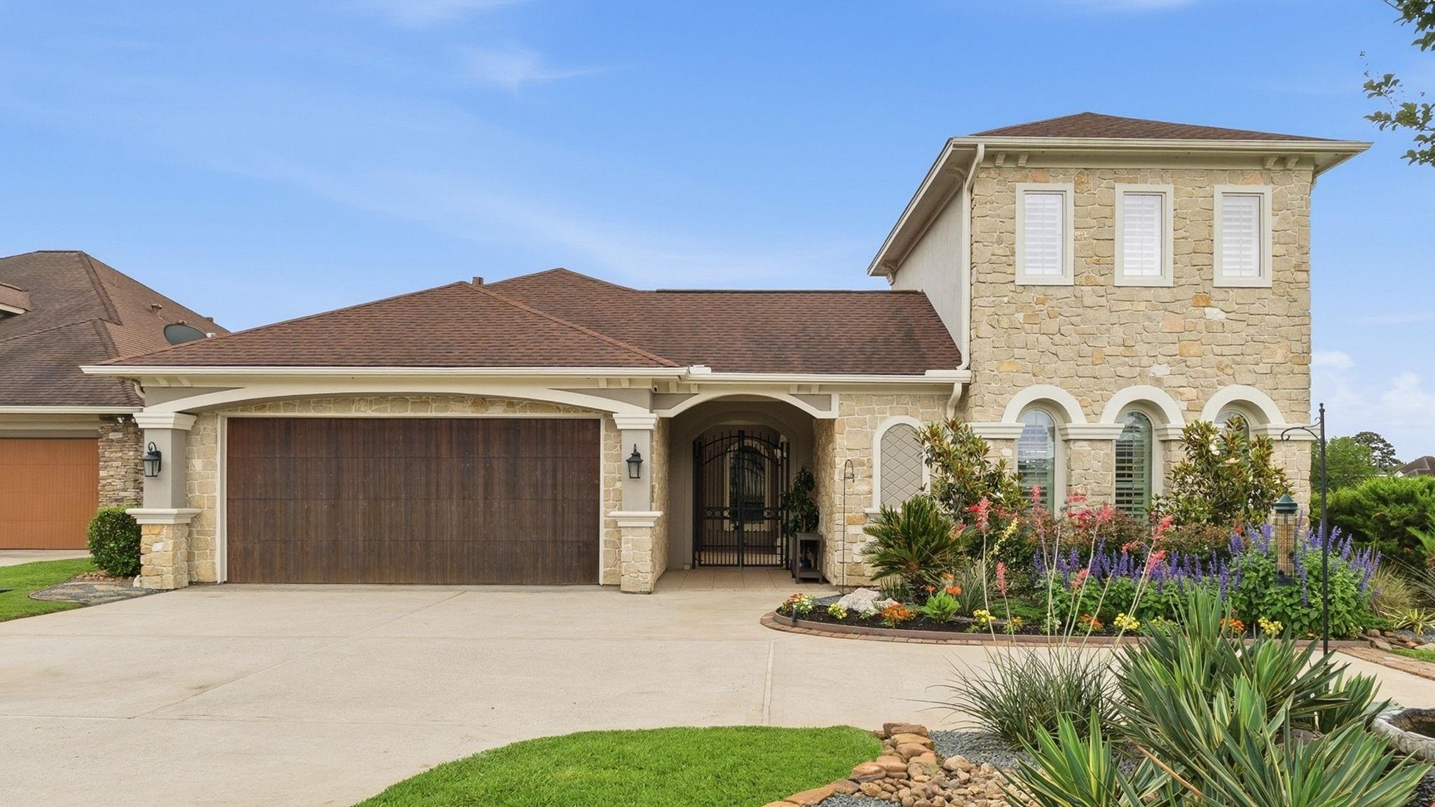 Image 2: Stunning curb appeal with views of attached garage