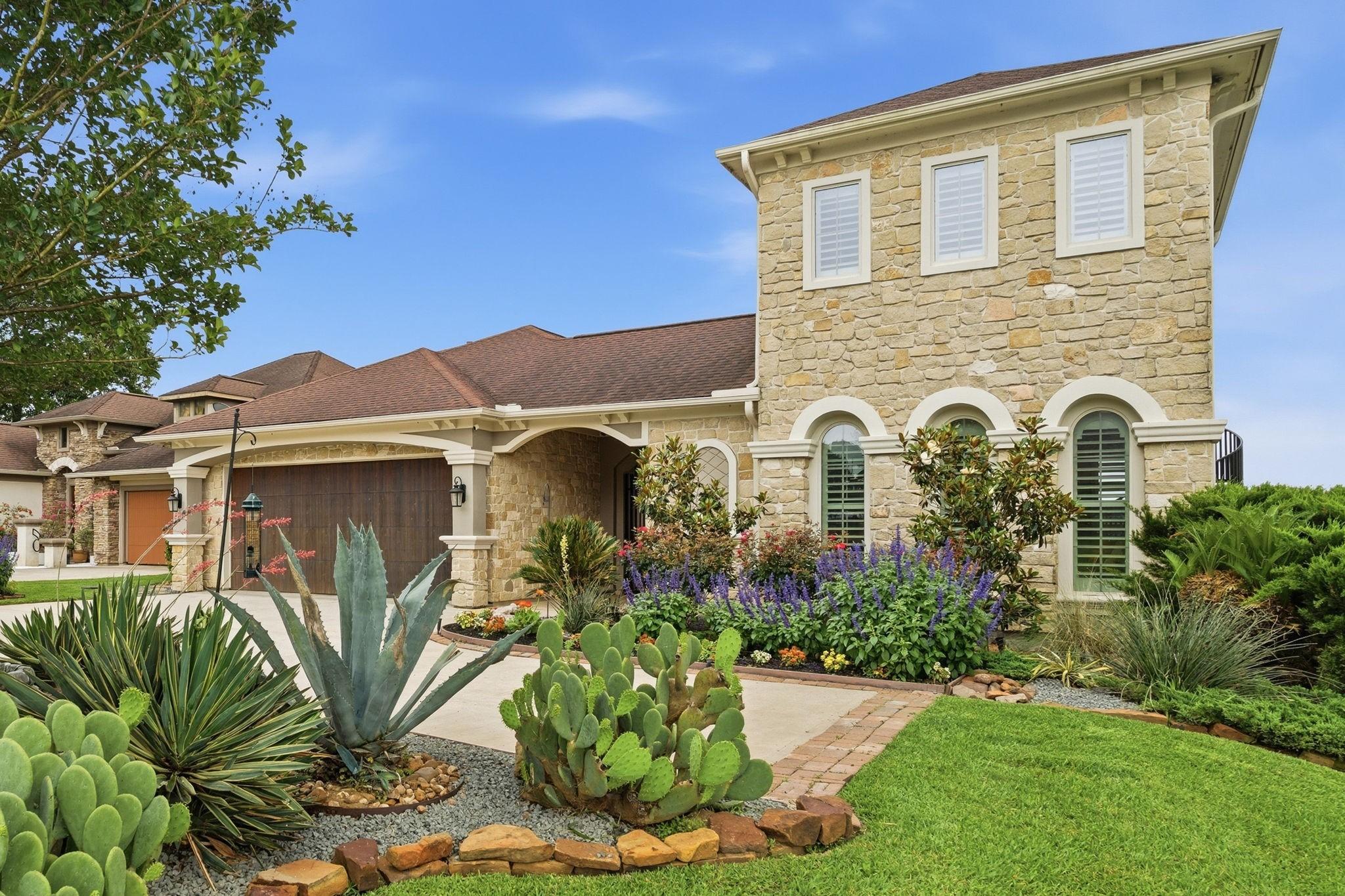 Image 3: Beautiful landscape surrounds this home.