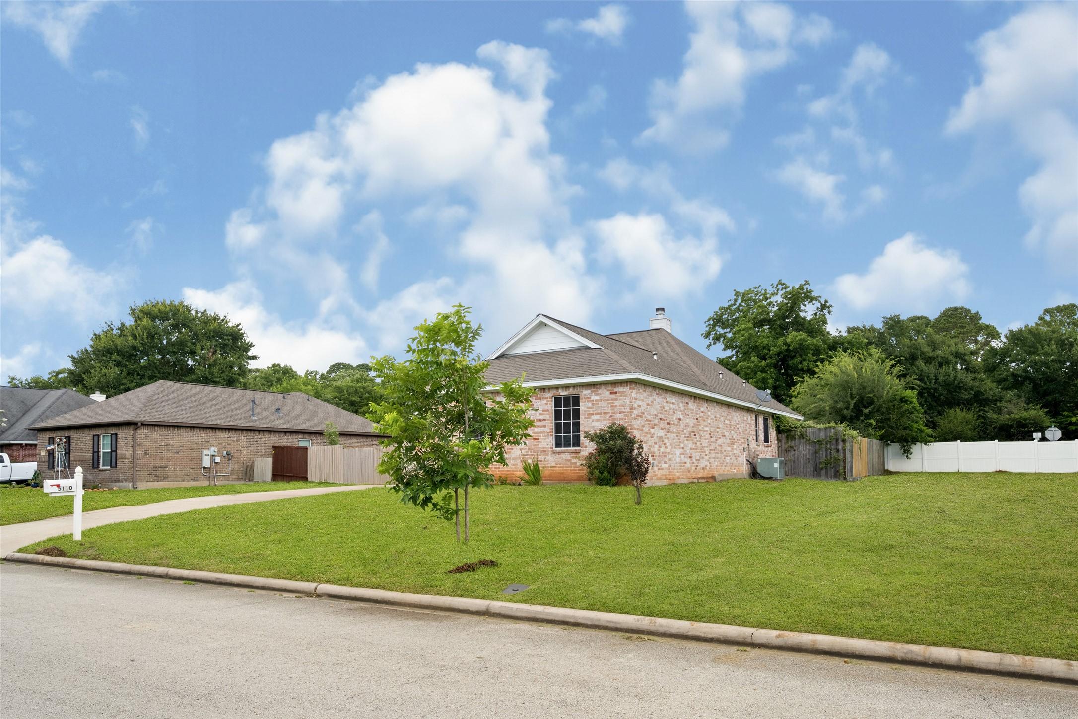 Image 1: Charming single-story home nestled on a spacious,