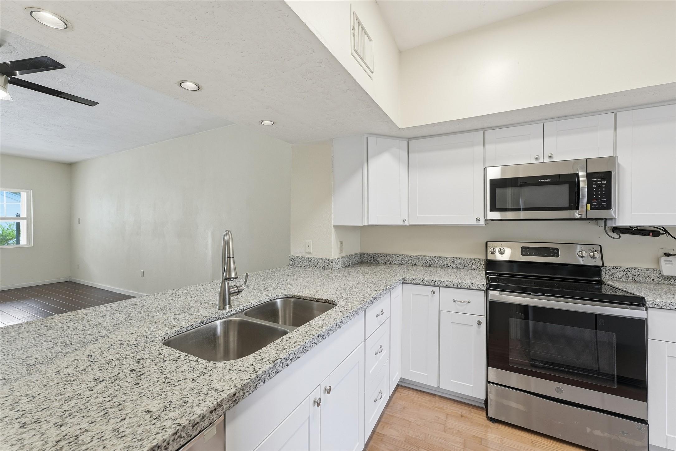Image 3: Granite countertops and fairly new appliances