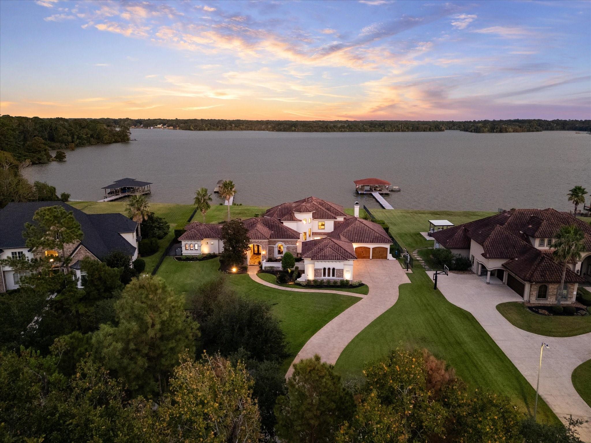 Image 2: The home is gracefully set back from the road, off