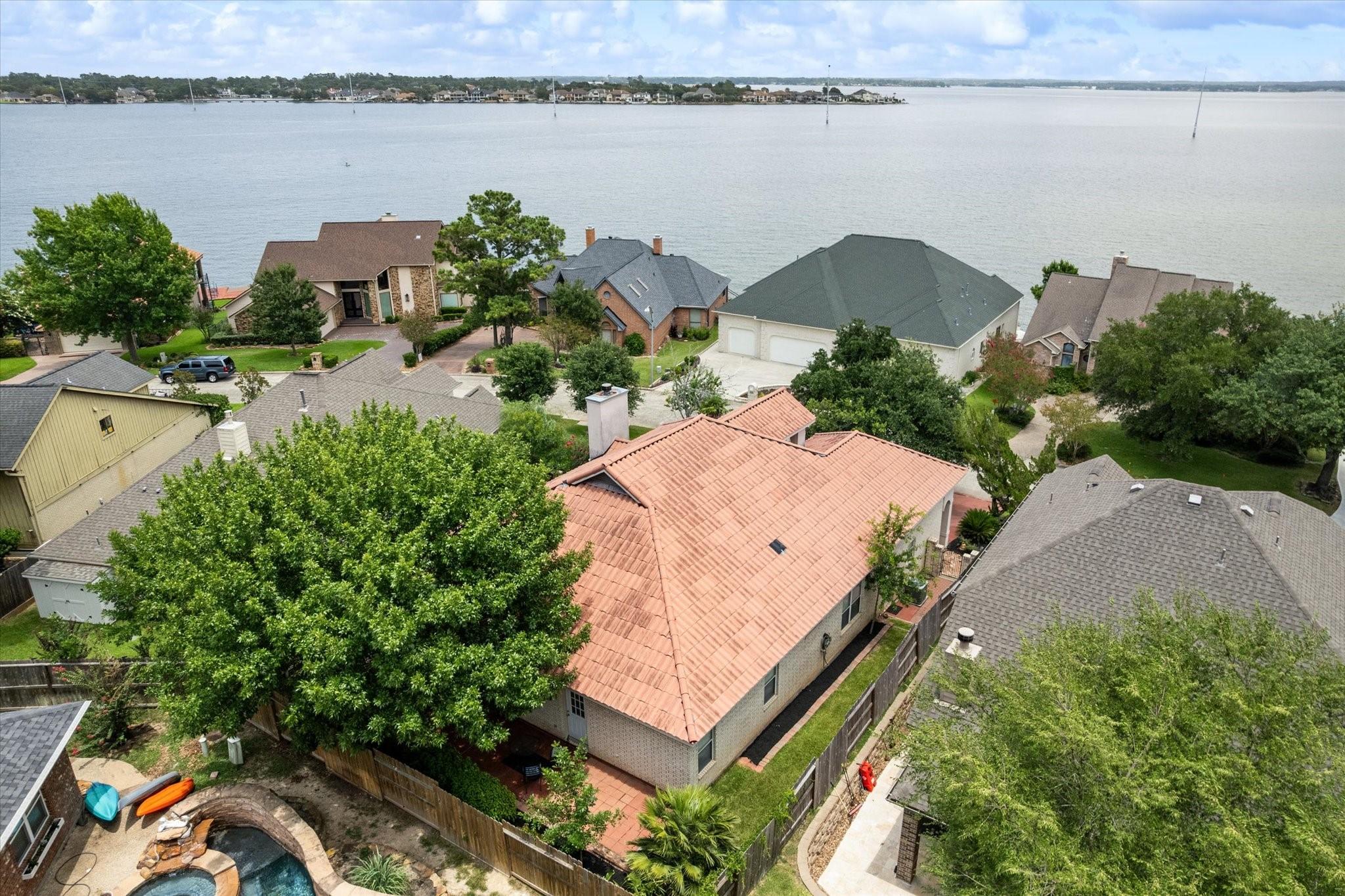 Image 2: Home sits directly across from the lake