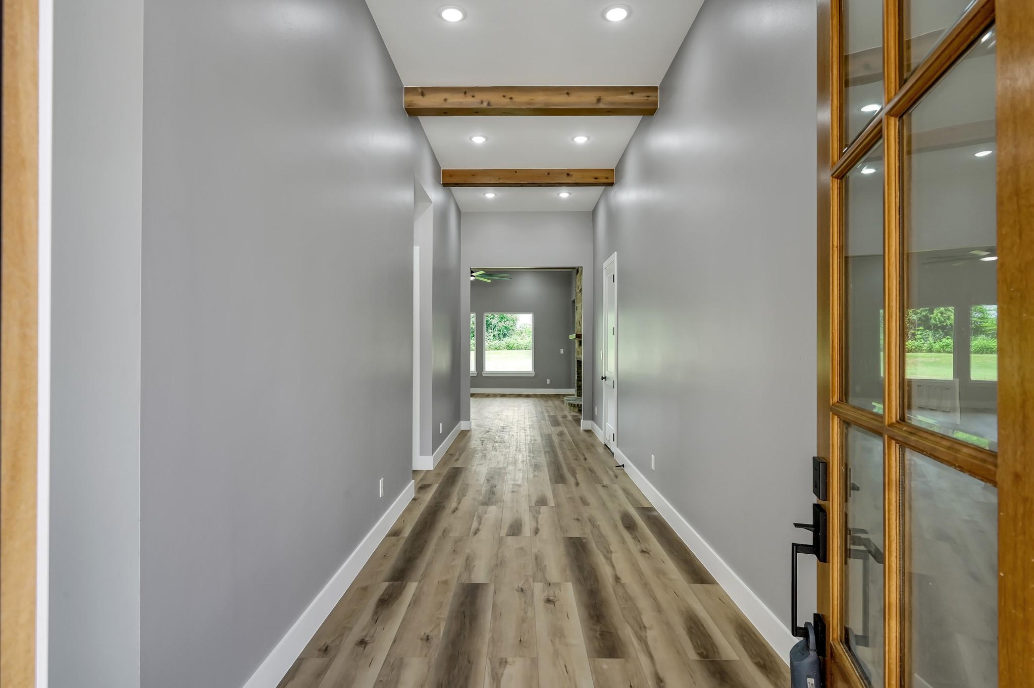 Image 3: Grand entryway with designer finishes.