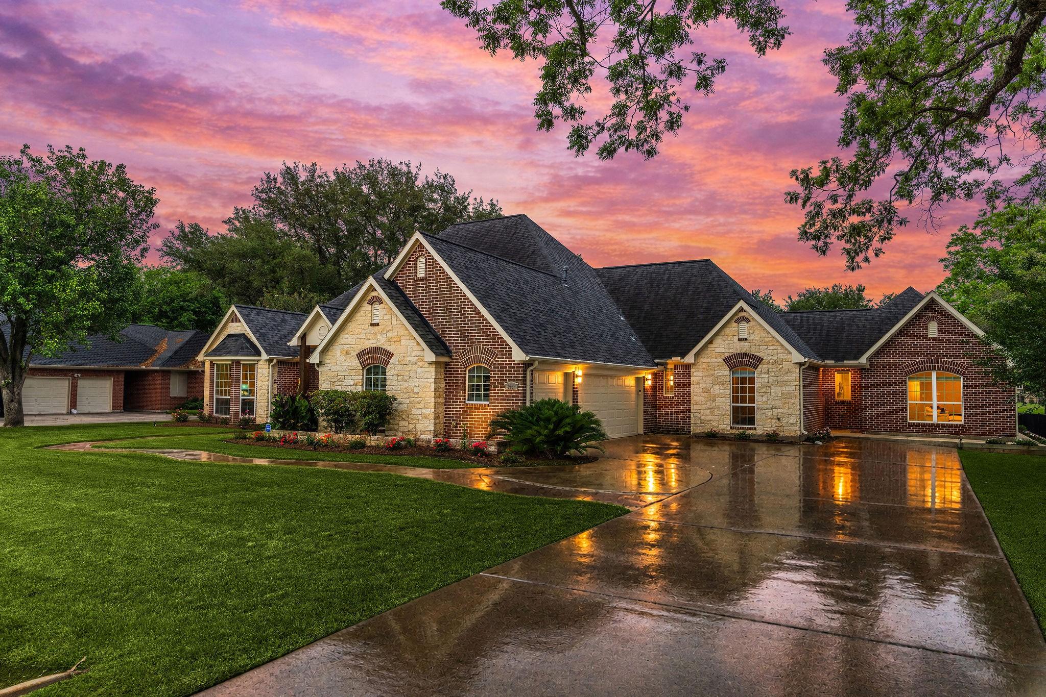 Image 2: This stunning home features a charming brick and s