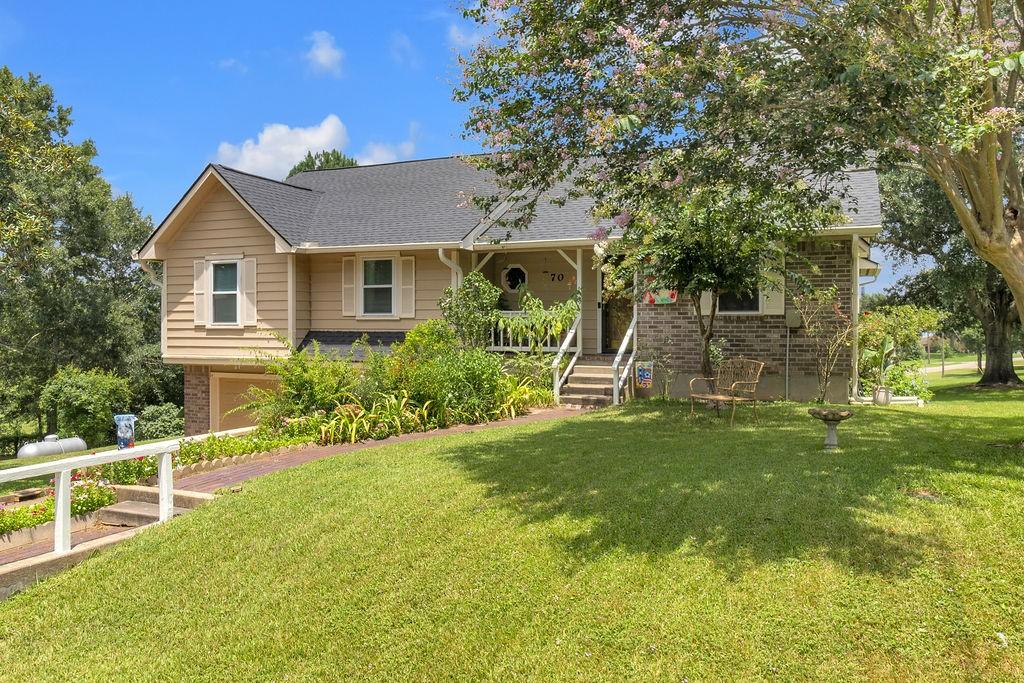 Image 2: This two story home is partially built into the ea