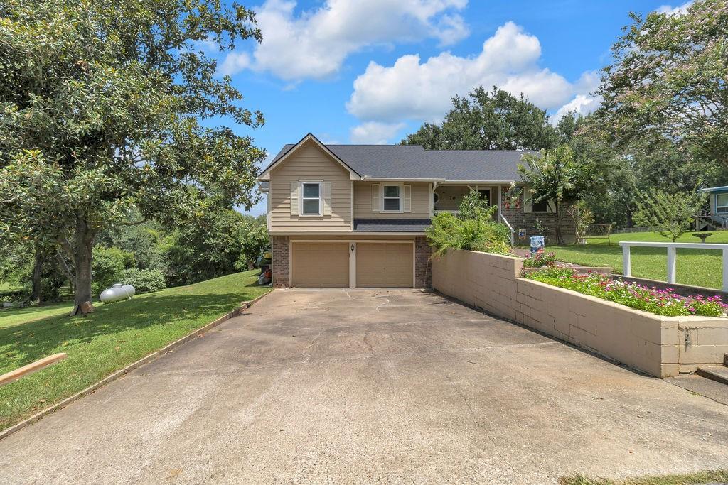 Image 3: Double drive way and two-car garage.