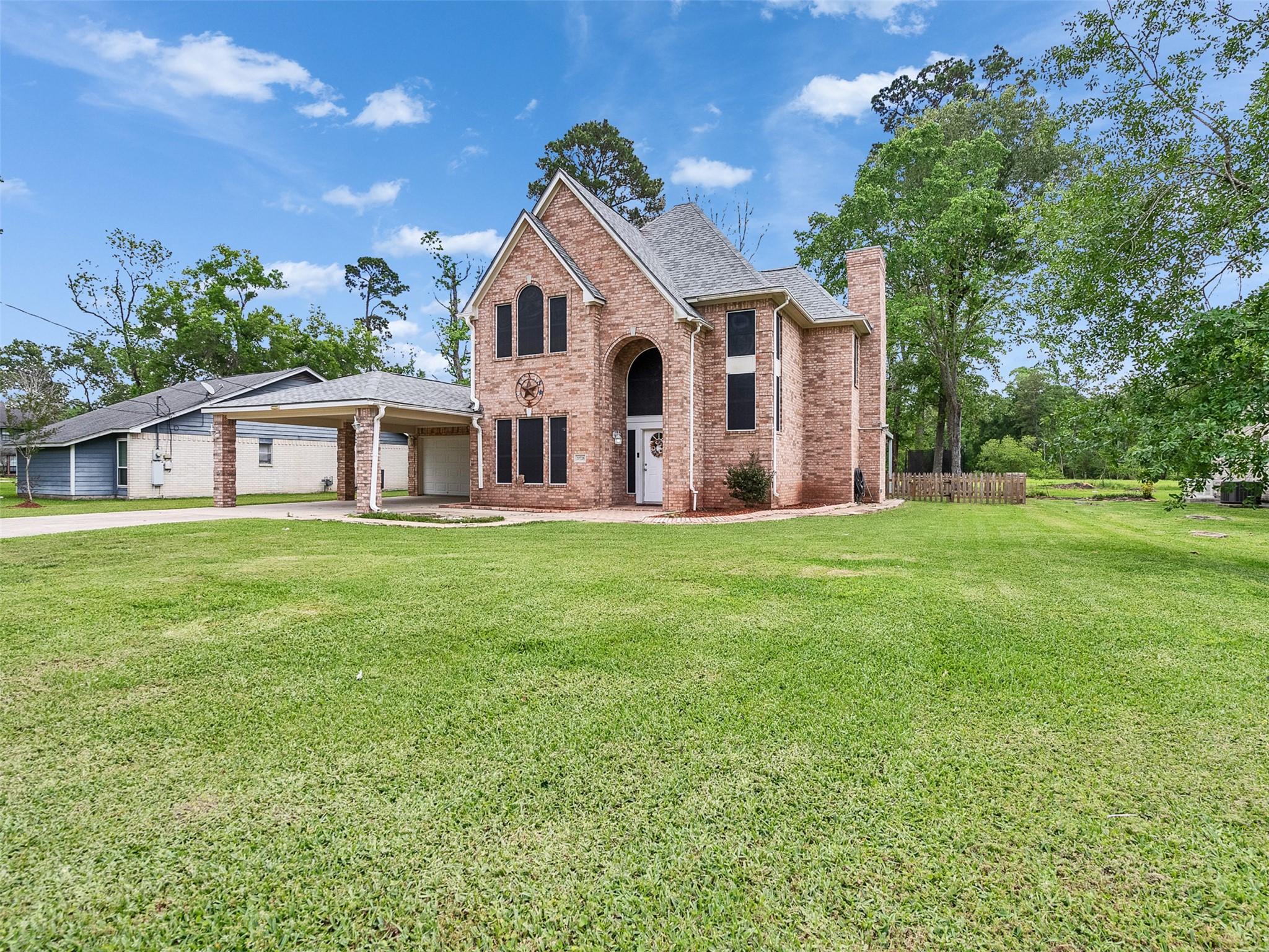 Image 2: This charming two-story brick home features a spac