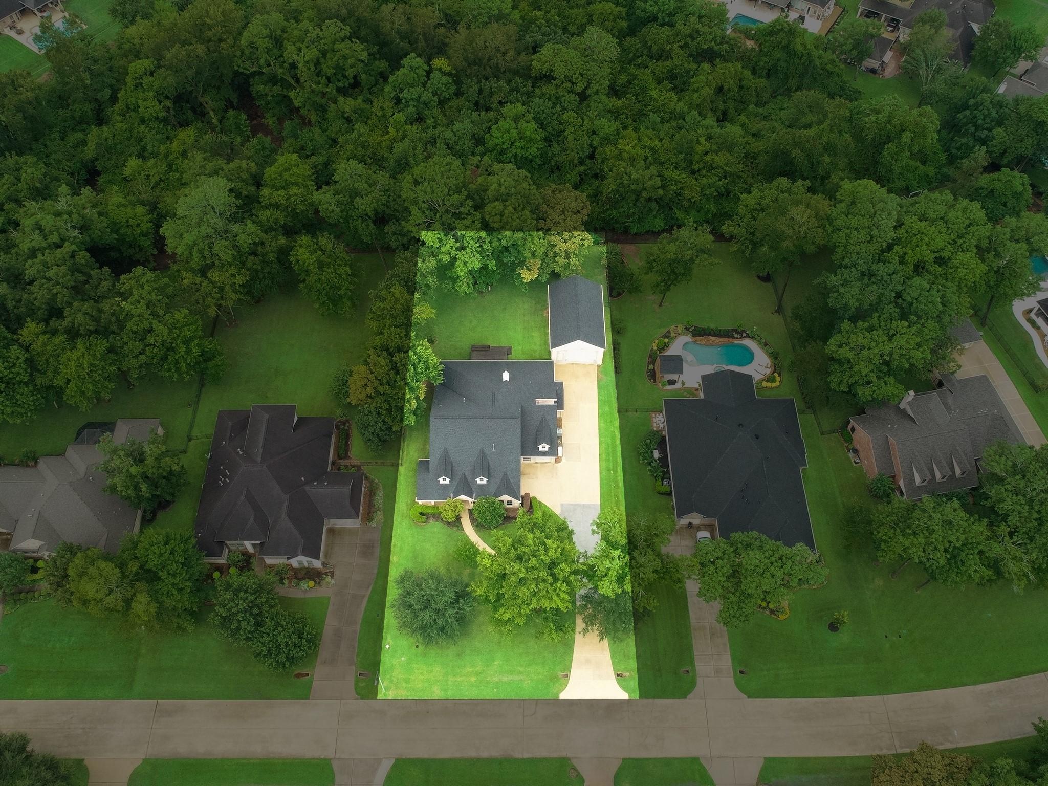 Image 2: Set far off the road, with no back neighbors, this