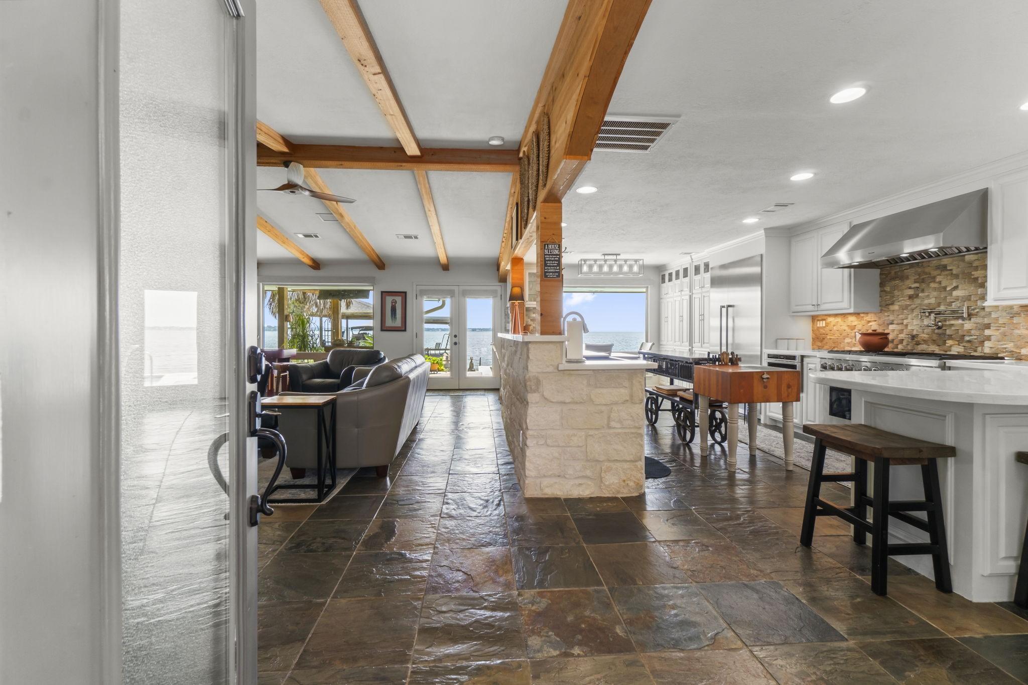 Image 4: This open-concept home features a spacious kitchen