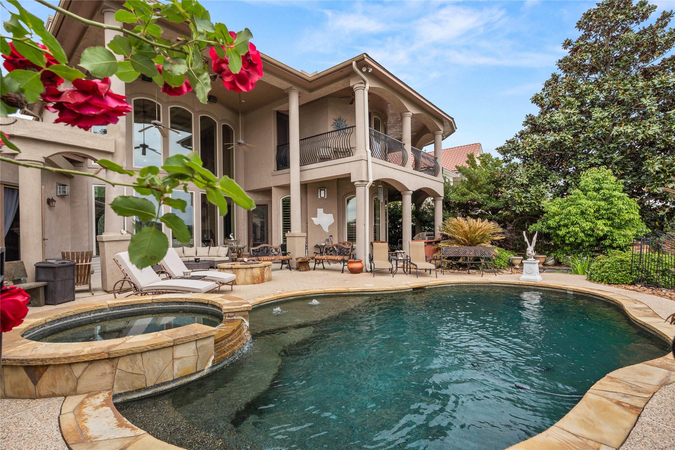 Image 2: Spacious backyard featuring a large swimming pool