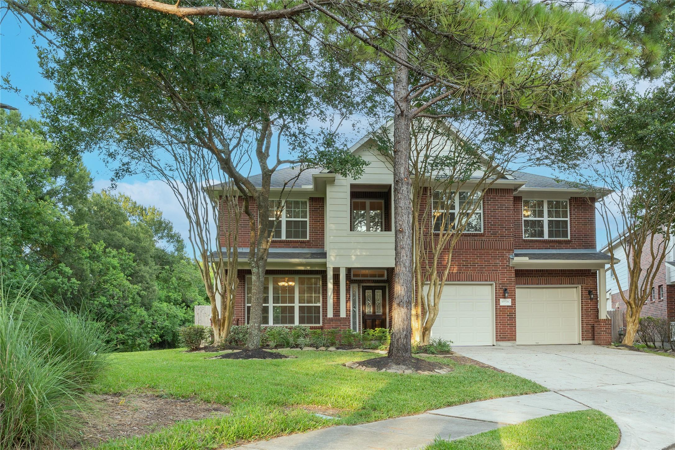 Image 1: Charming two-story brick home with a double garage