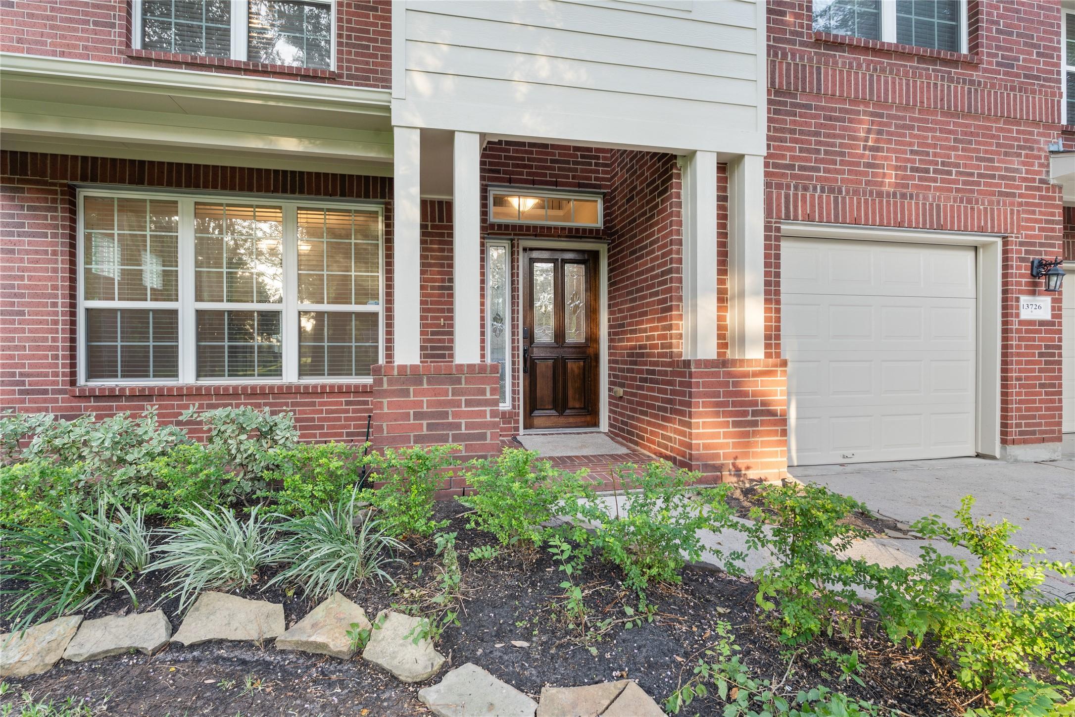 Image 4: This inviting home features a charming brick exter