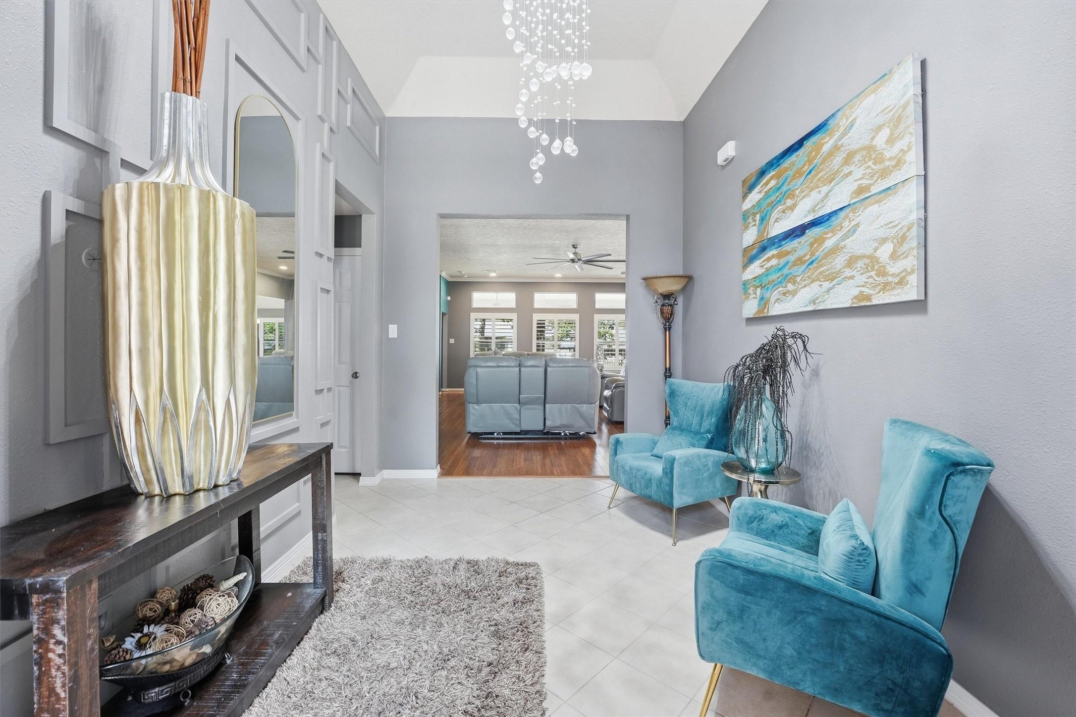 Image 3: Welcome to an elegant entryway featuring high ceil