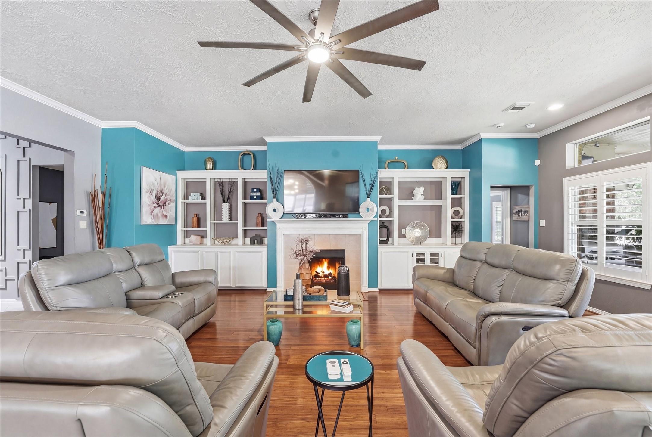 Image 4: This inviting family room features elegant designe