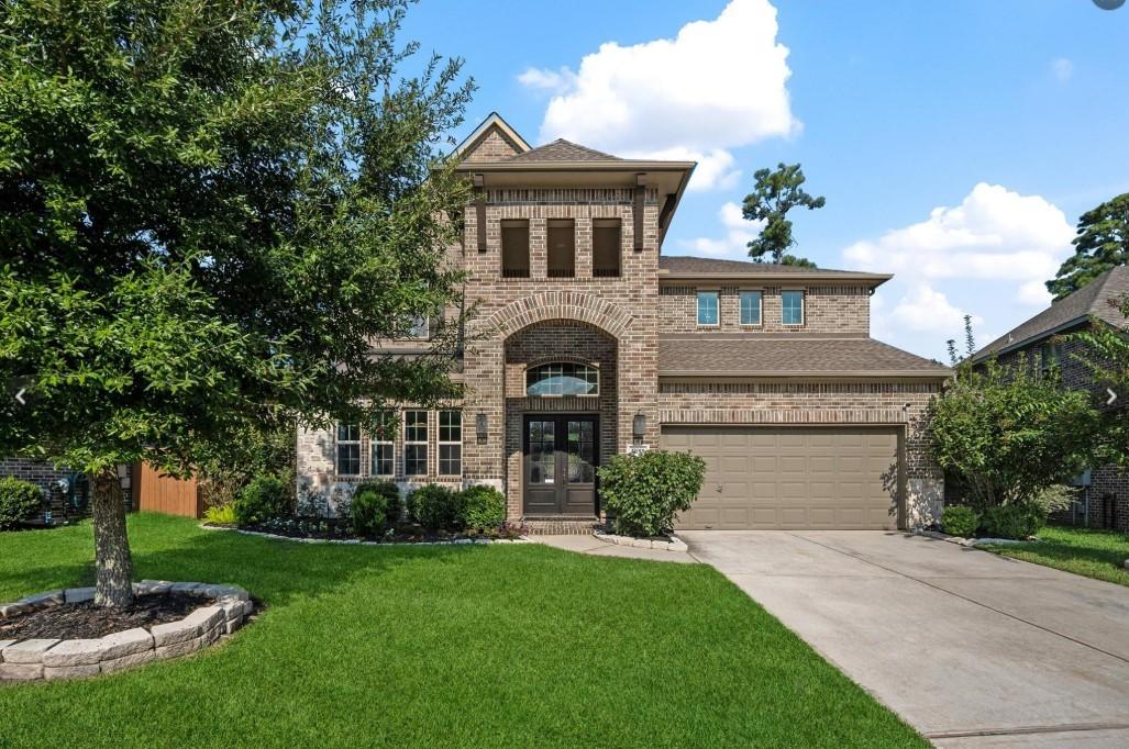 Image 1: This stunning home is nestled in the exclusive gat