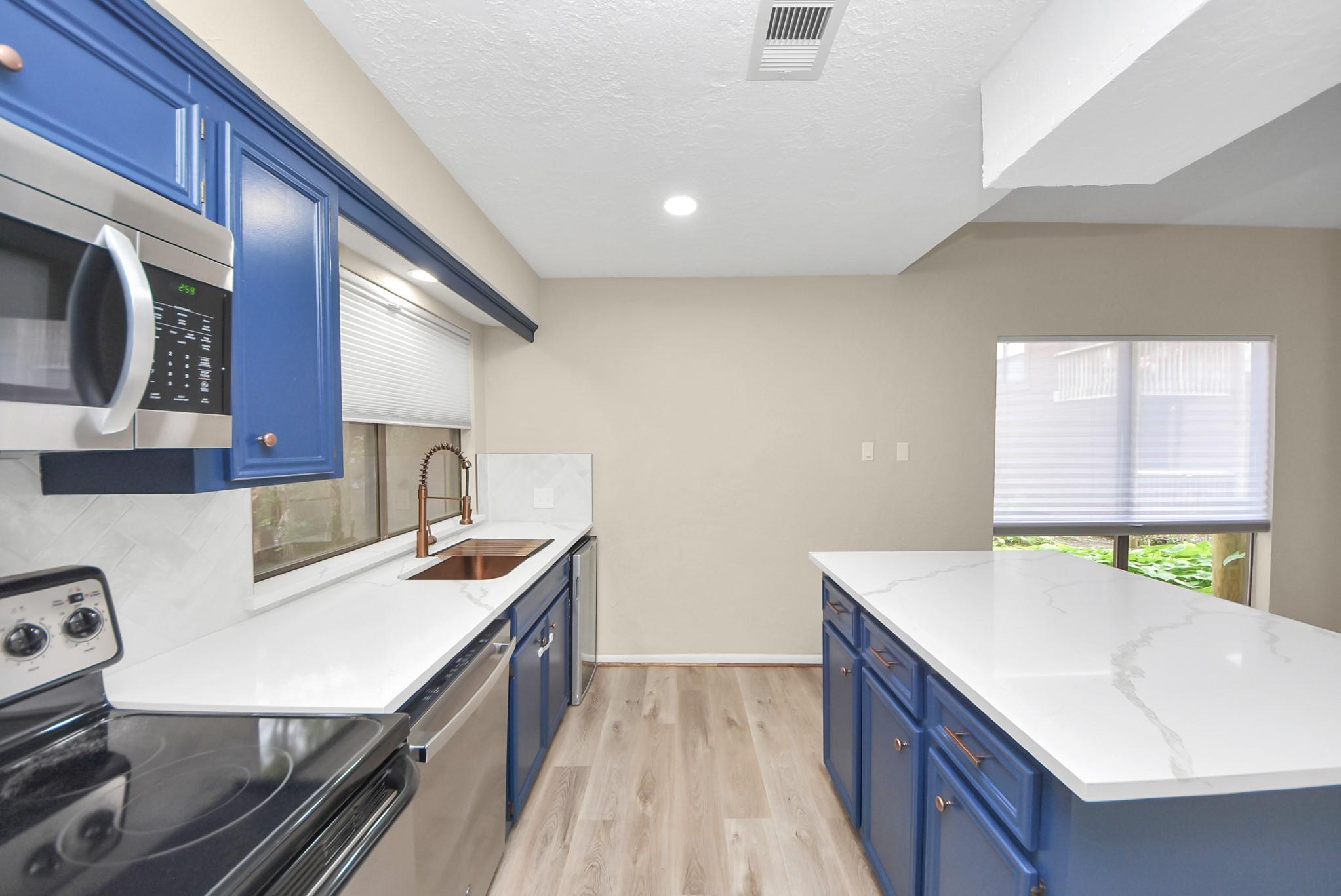 Image 1: Backsplash makes a nice accent tot he quartz count