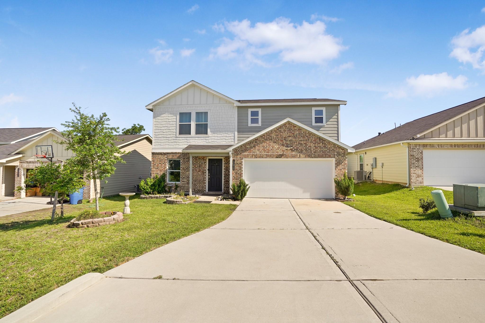 Image 3: Charming two-story home with a classic brick facad