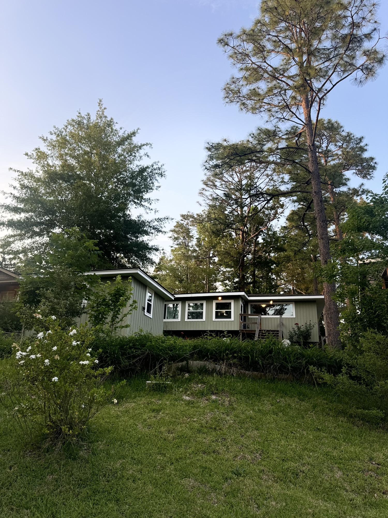 Image 3: The new windows, tasteful siding, landscaping and