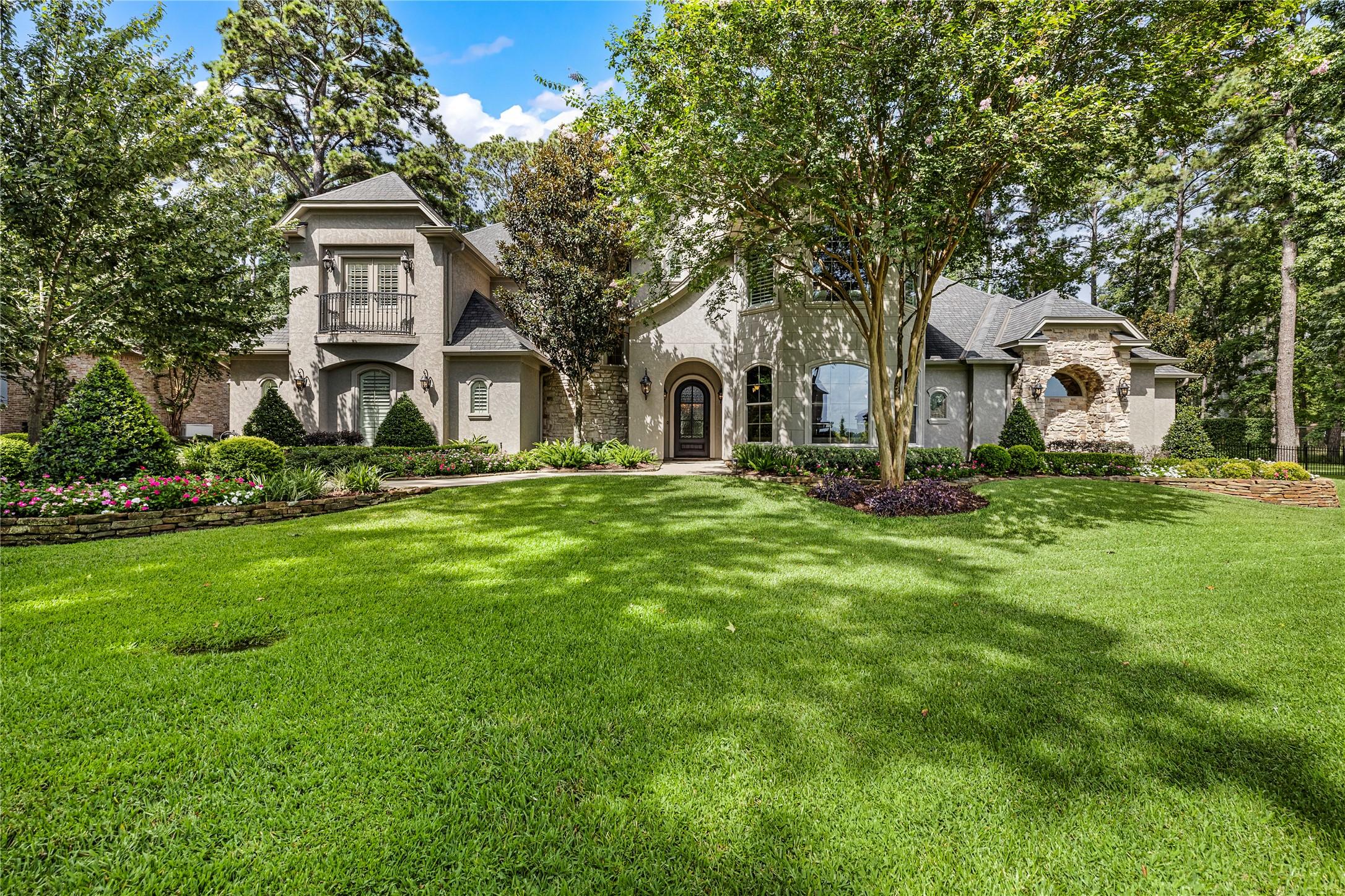 Image 2: Beautiful, mature landscaping adorns the entire pr