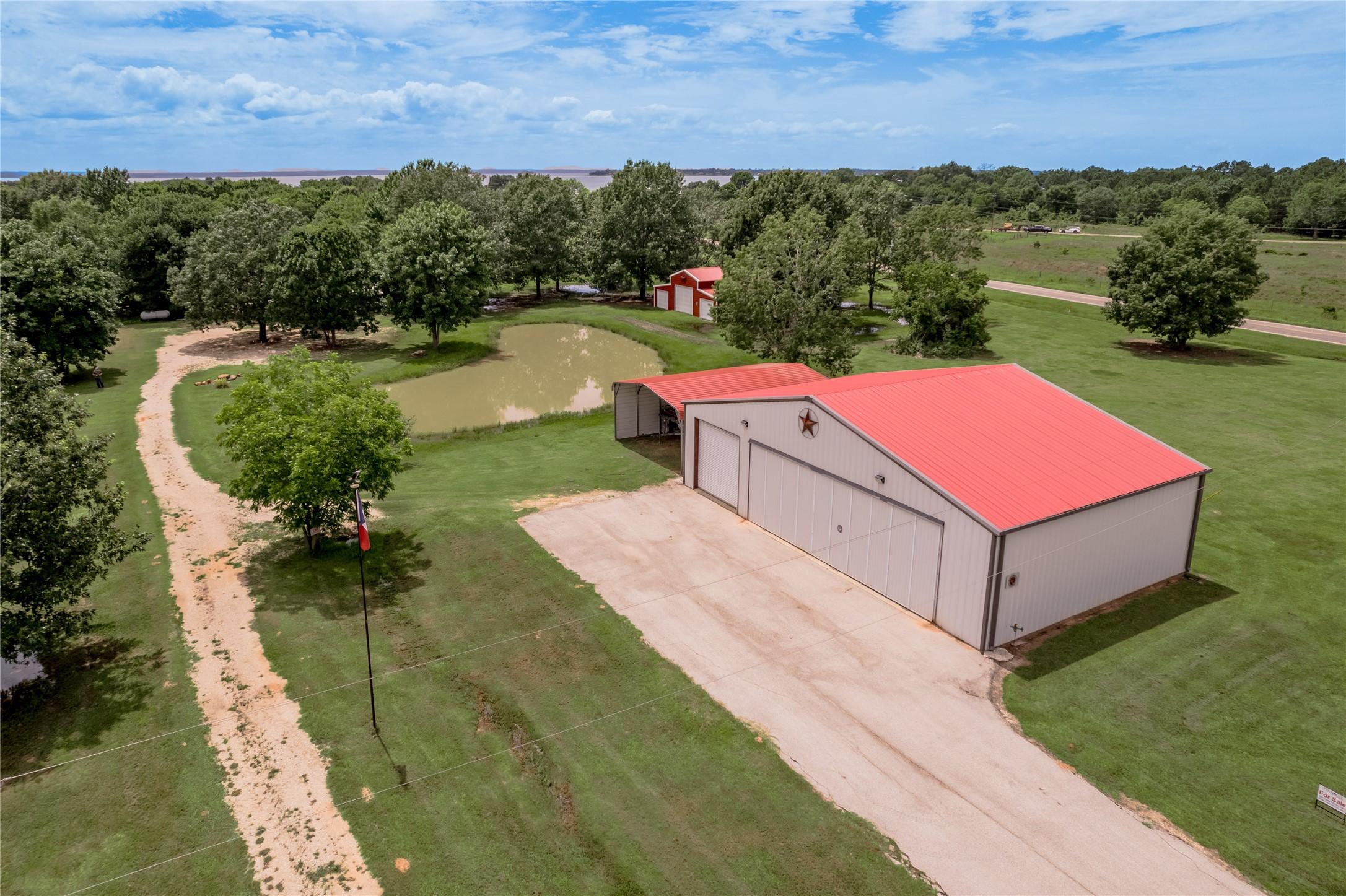 Image 2: 60x40 airplane hangar.  Has one roll-up door, a sc