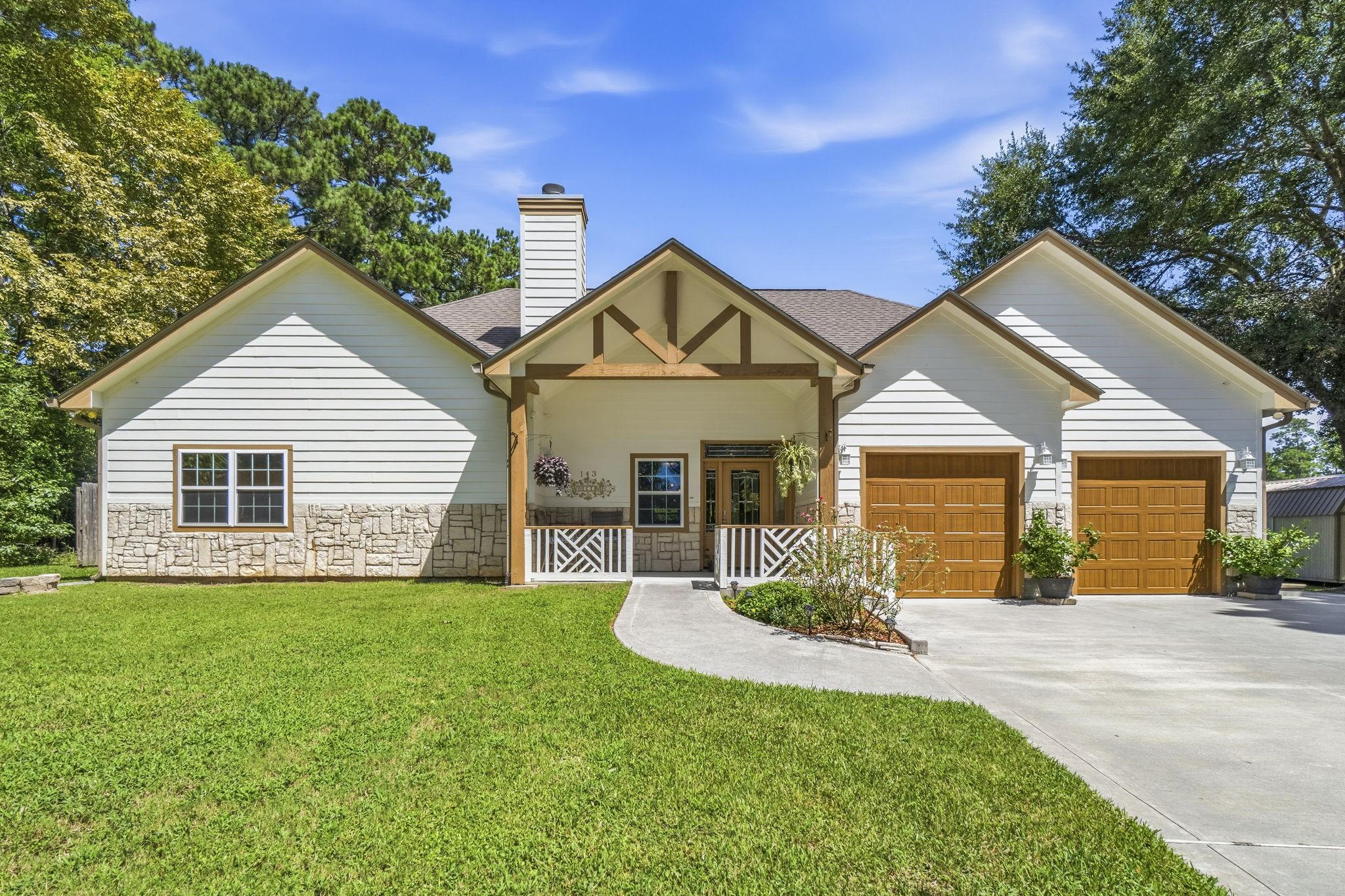 Image 2: Charming single-story home with a spacious front y
