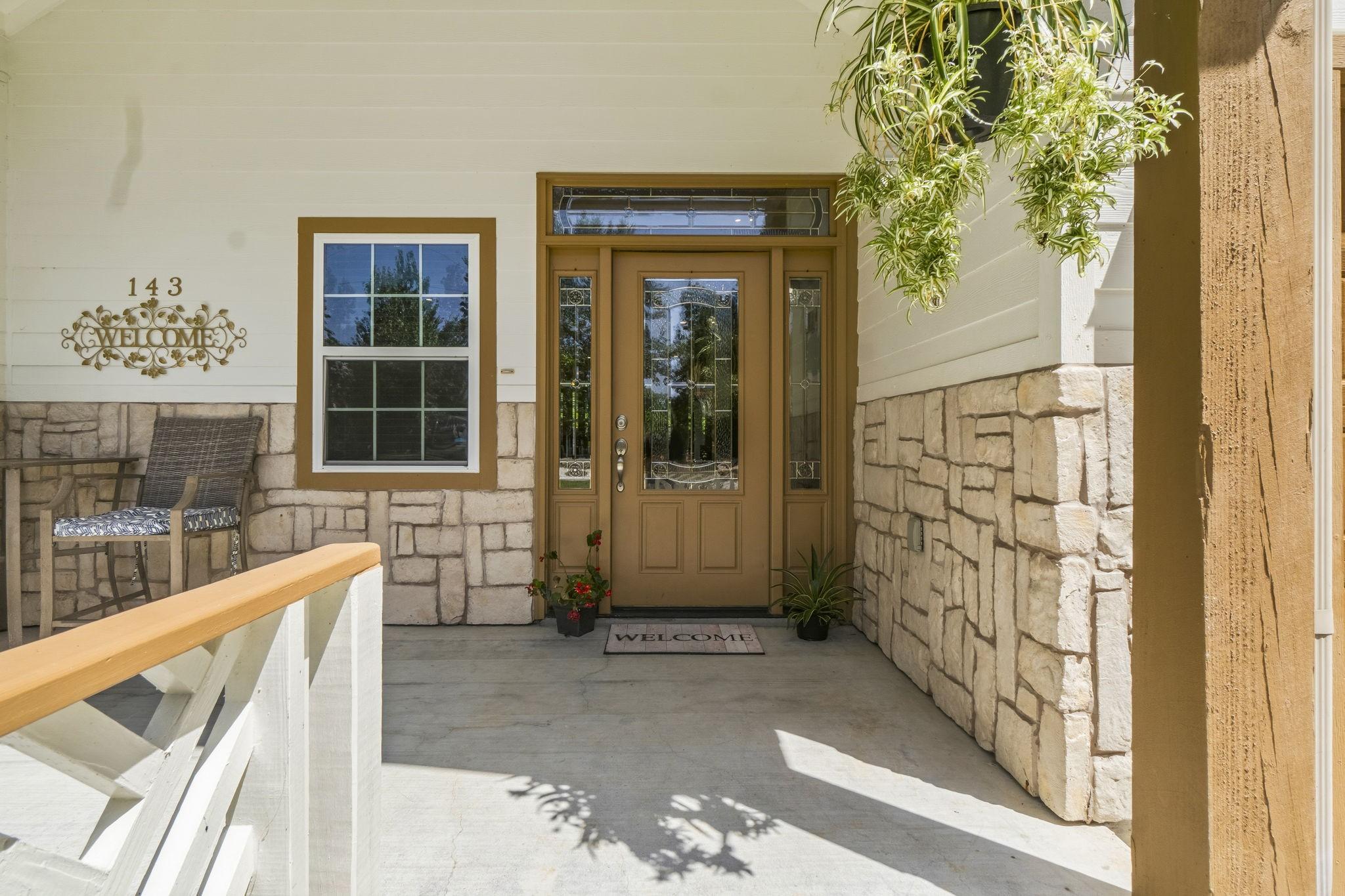 Image 3: Charming entryway featuring a warm wooden door, el