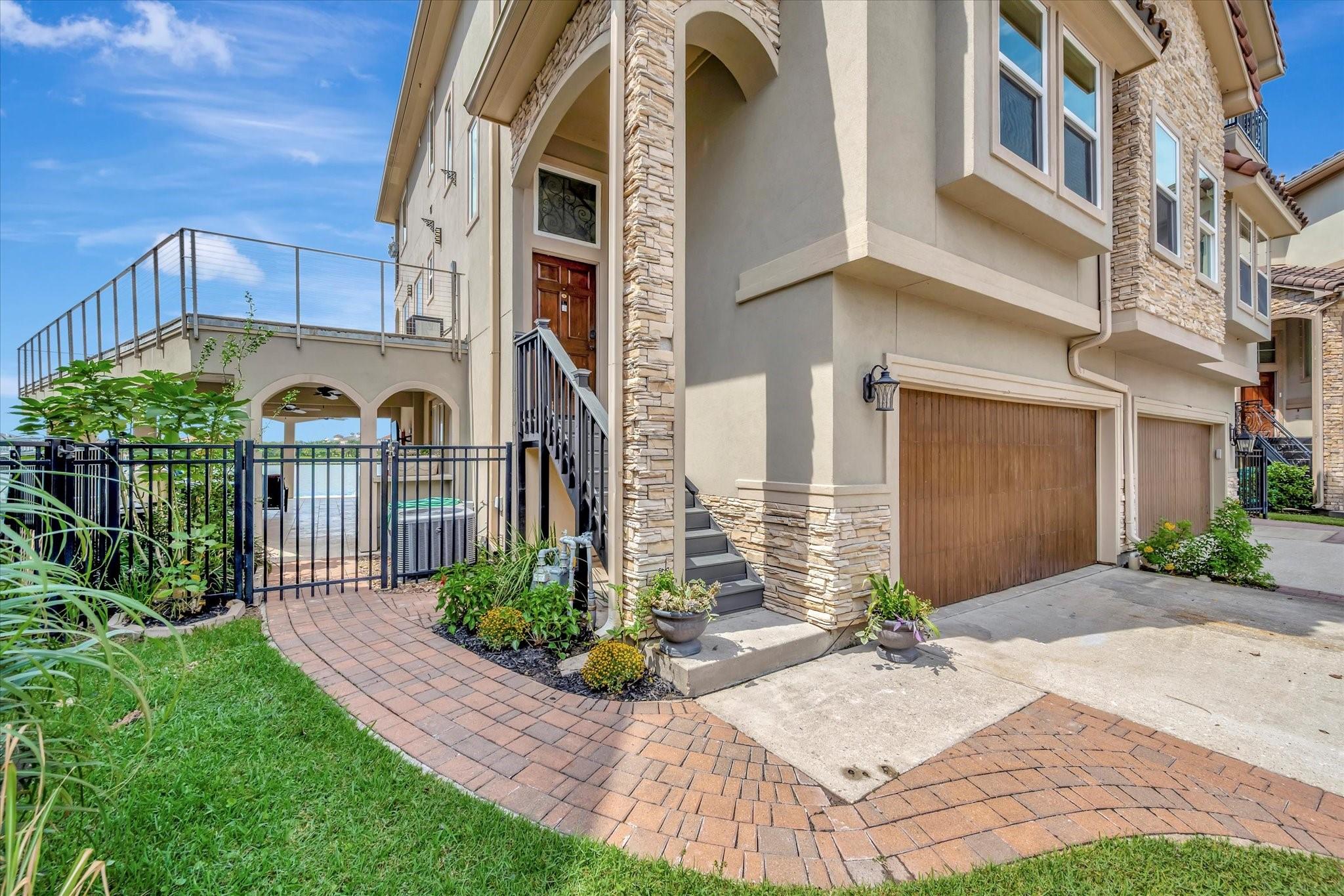 Image 4: The inviting entrance showcases a rich wooden fron