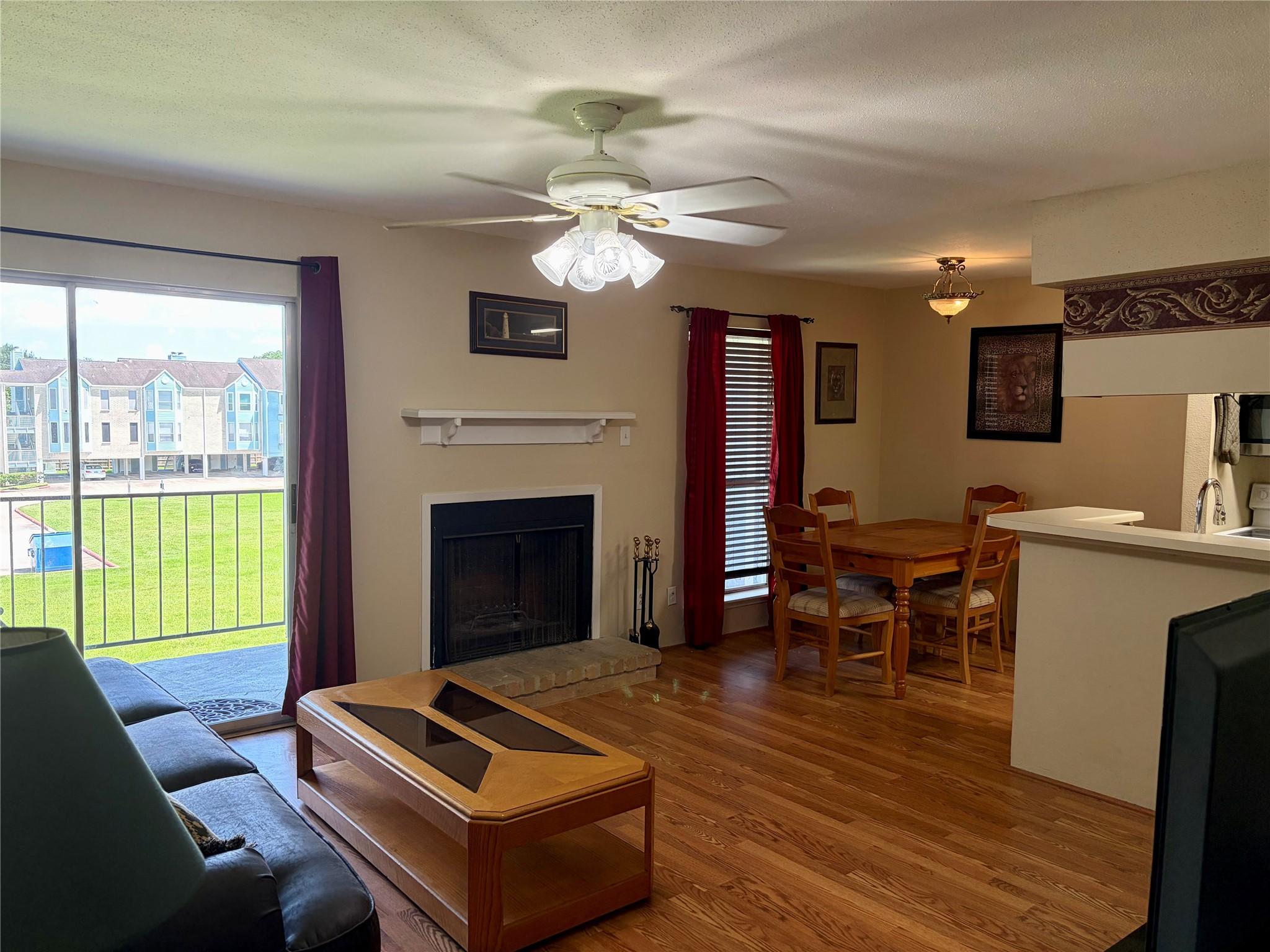 Image 3: Living room with wood burning fireplace