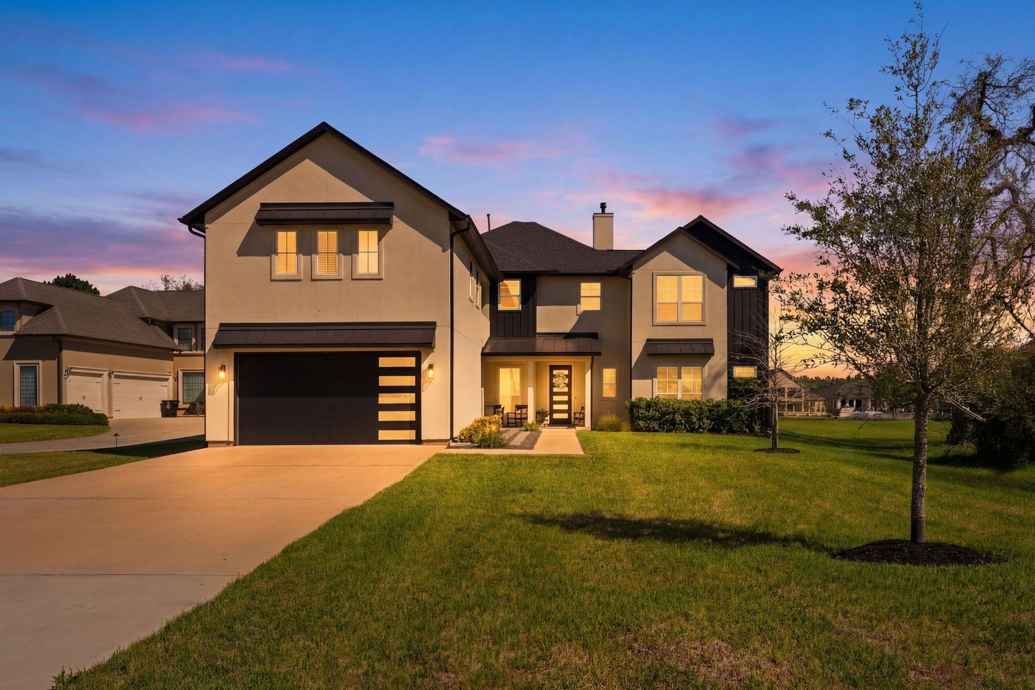 Image 2: This modern two-story home features a sleek exteri