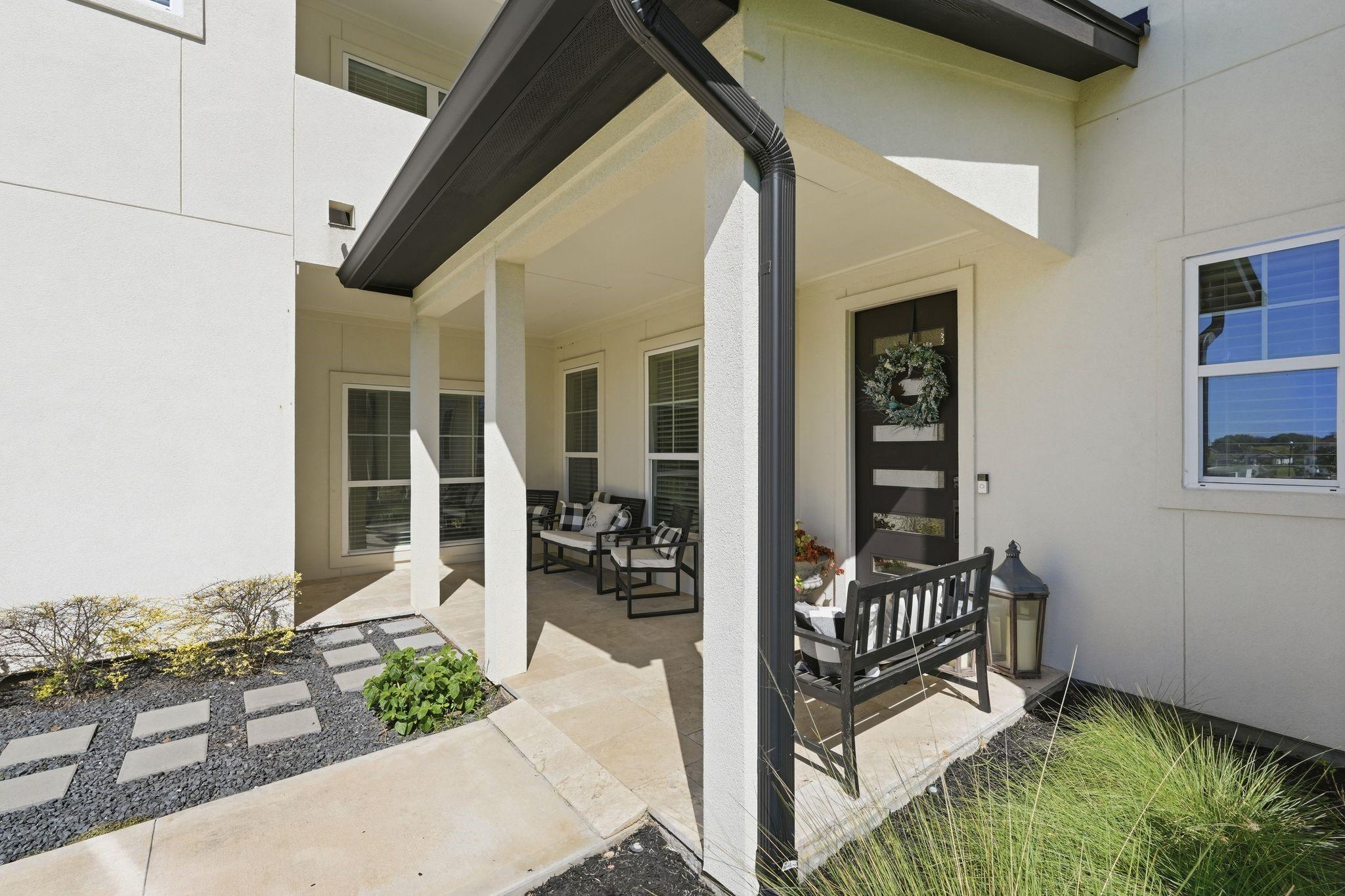 Image 4: This photo showcases a modern home's inviting fron