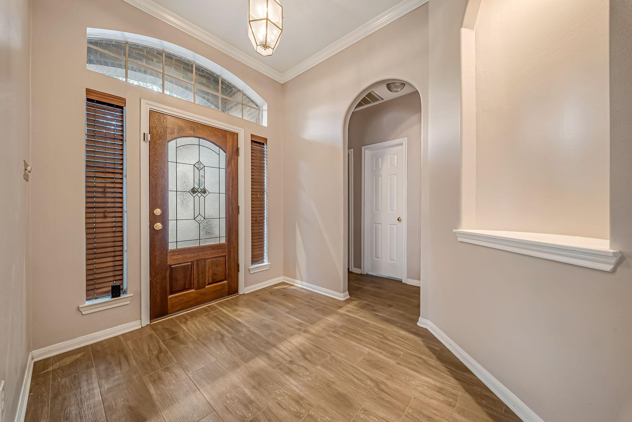 Image 2: Escape to the oversized primary suite showcasing a