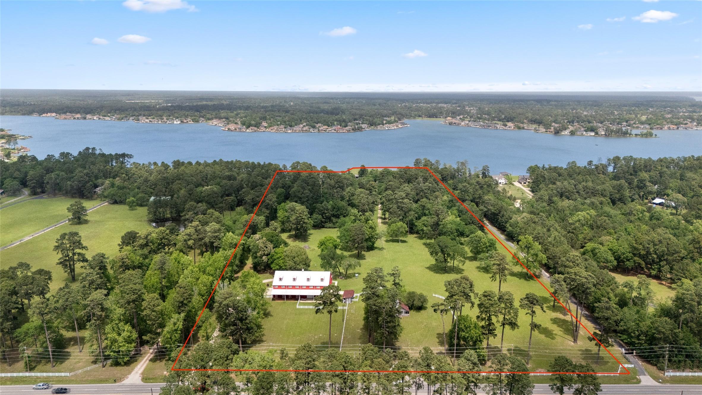 Image 1: Expansive property with a barndominium, surrounded