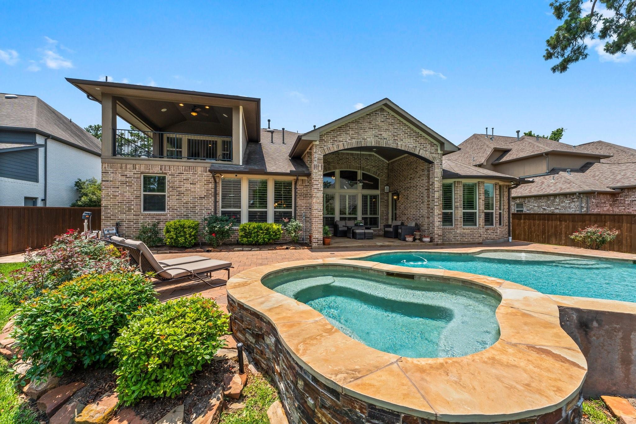 Image 1: Private backyard oasis with pool, spa, and expansi
