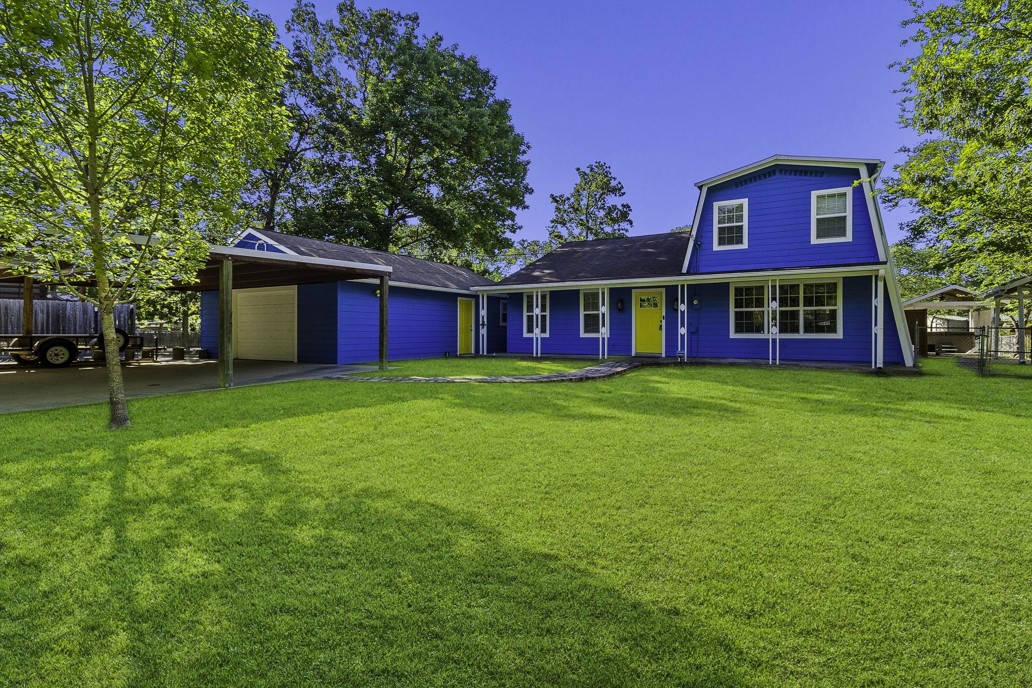 Image 1: Front view of the home