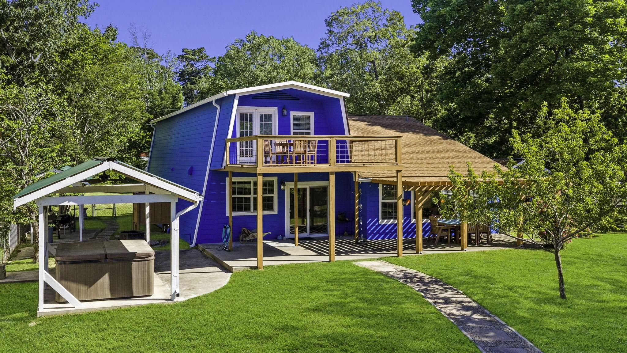 Image 2: Back view of the home