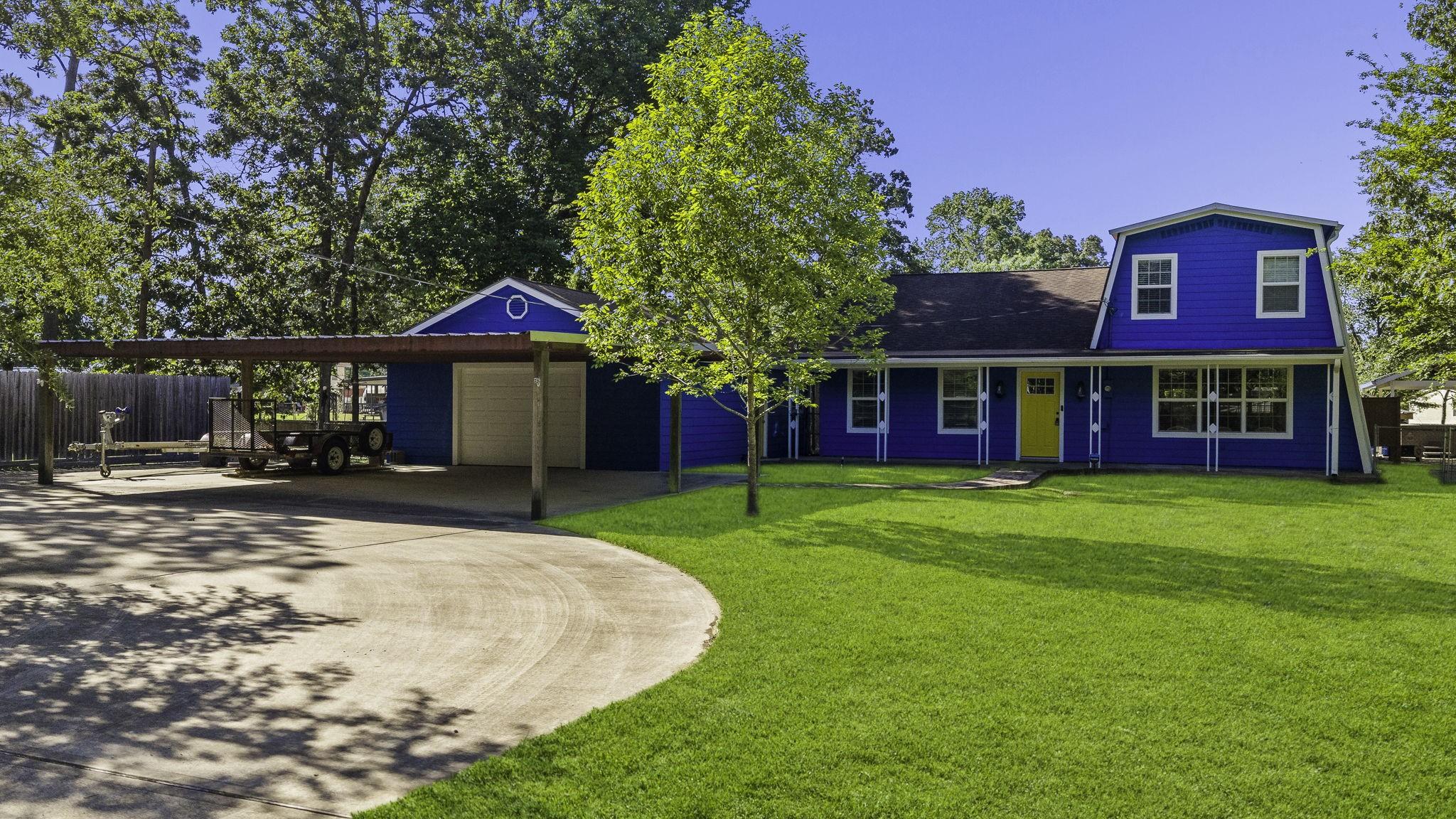 Image 4: Circle drive to oversized garage, carport, and wor