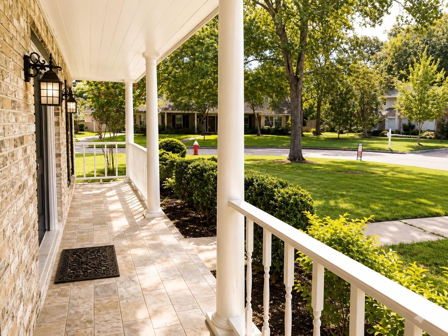 Image 2: Front patio runs the length of the front of the ho
