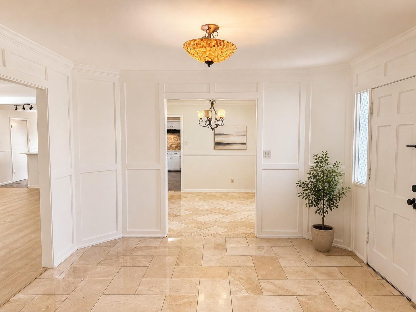 Image 3: Grand Foyer with marble flooring.