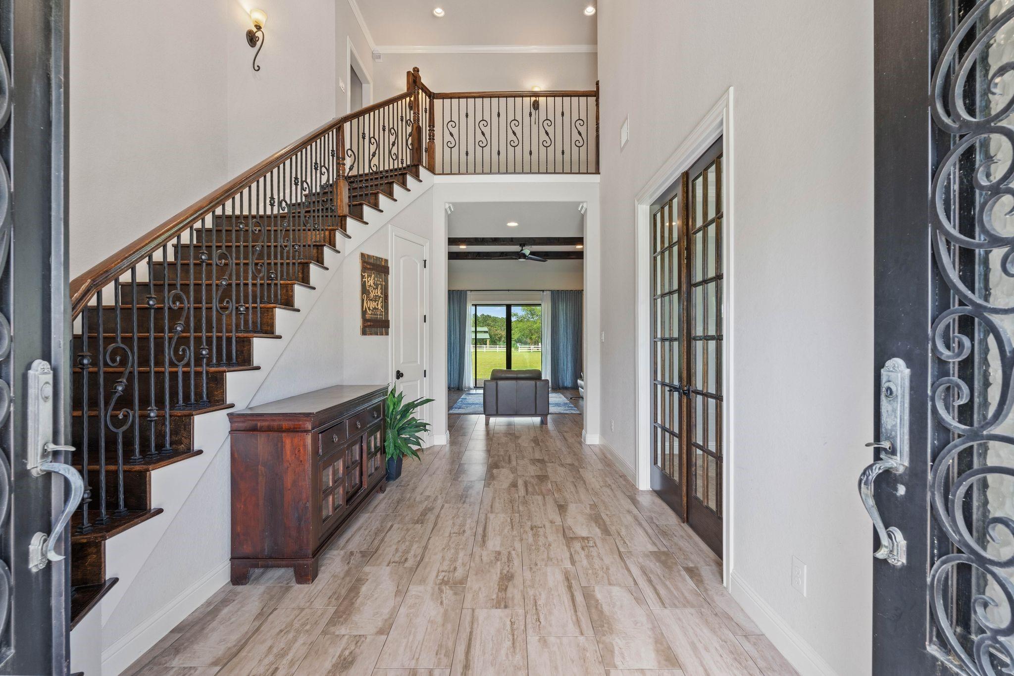 Image 4: Welcome to a stunning entryway featuring elegant