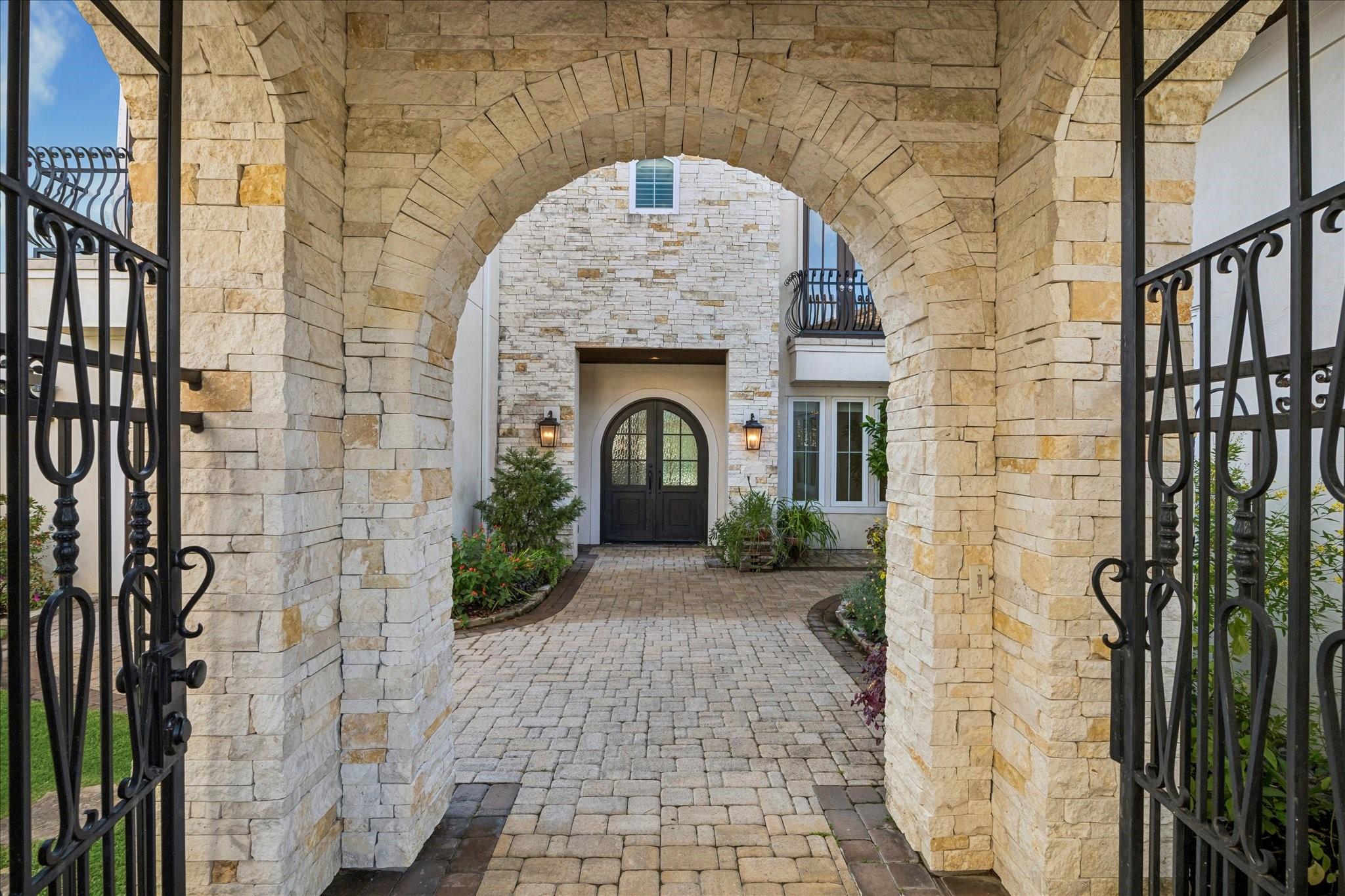 Image 2: This photo showcases an inviting stone archway lea