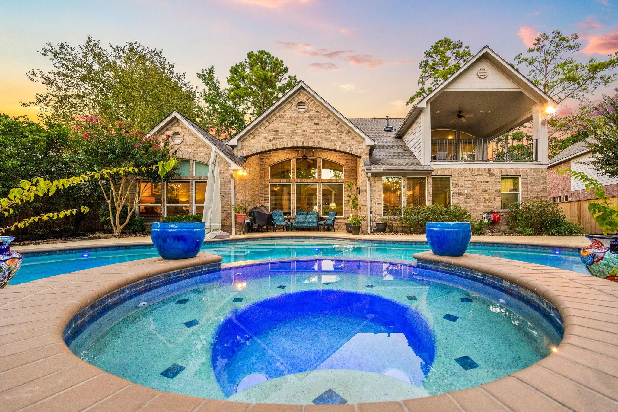 Image 1: Backyard paradise featuring a sparkling pool and s