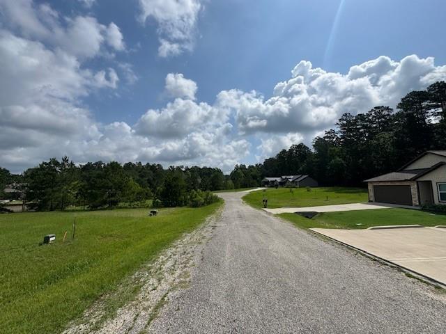 Image 4: LOOKING DOWN STREET FROM LOT.  iT IS A CULDESAC ST