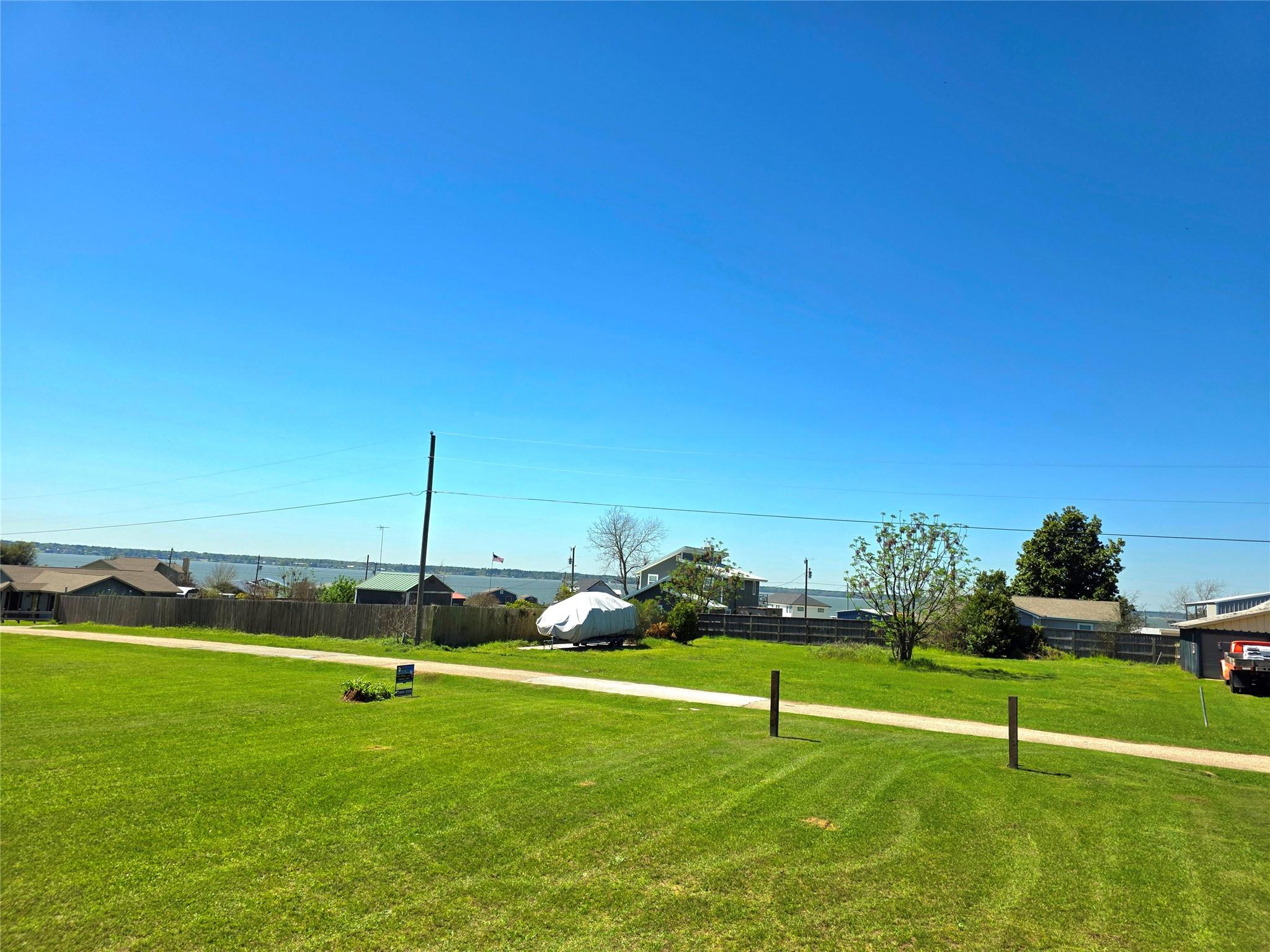 Image 3: Photo Showcasing the driveway leading onto the lot