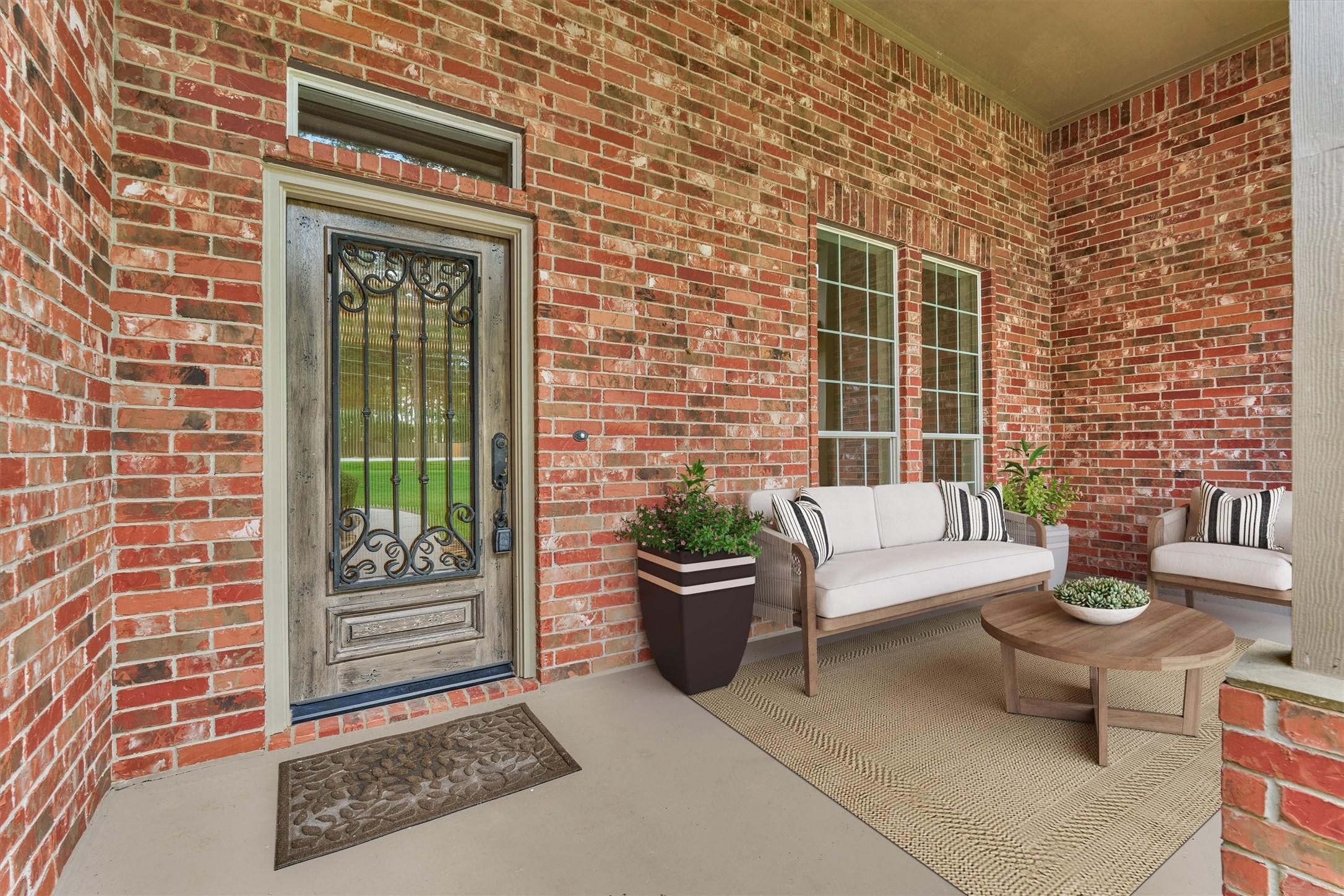 Image 2: A charming covered front porch offers a preview of