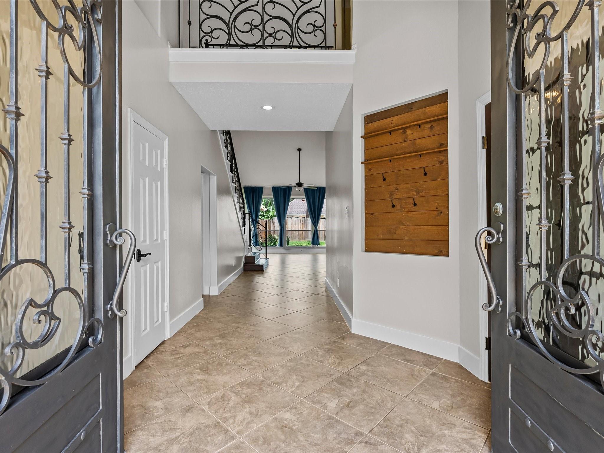 Image 2: Step through the immaculate wrought iron front doo