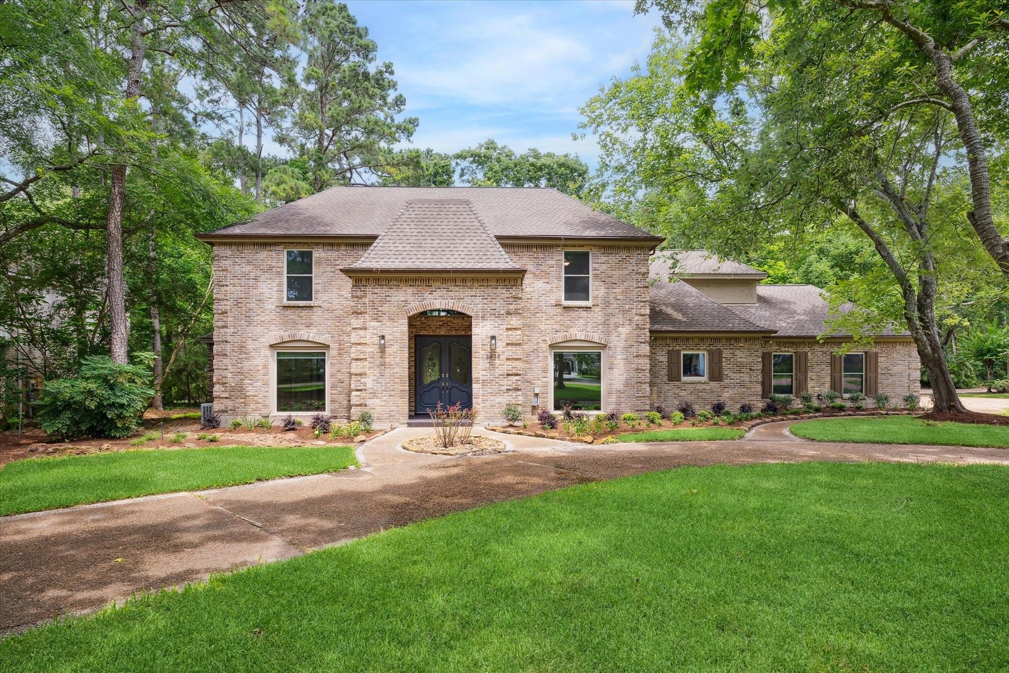 Image 2: Discover timeless charm in this two-story brick ho