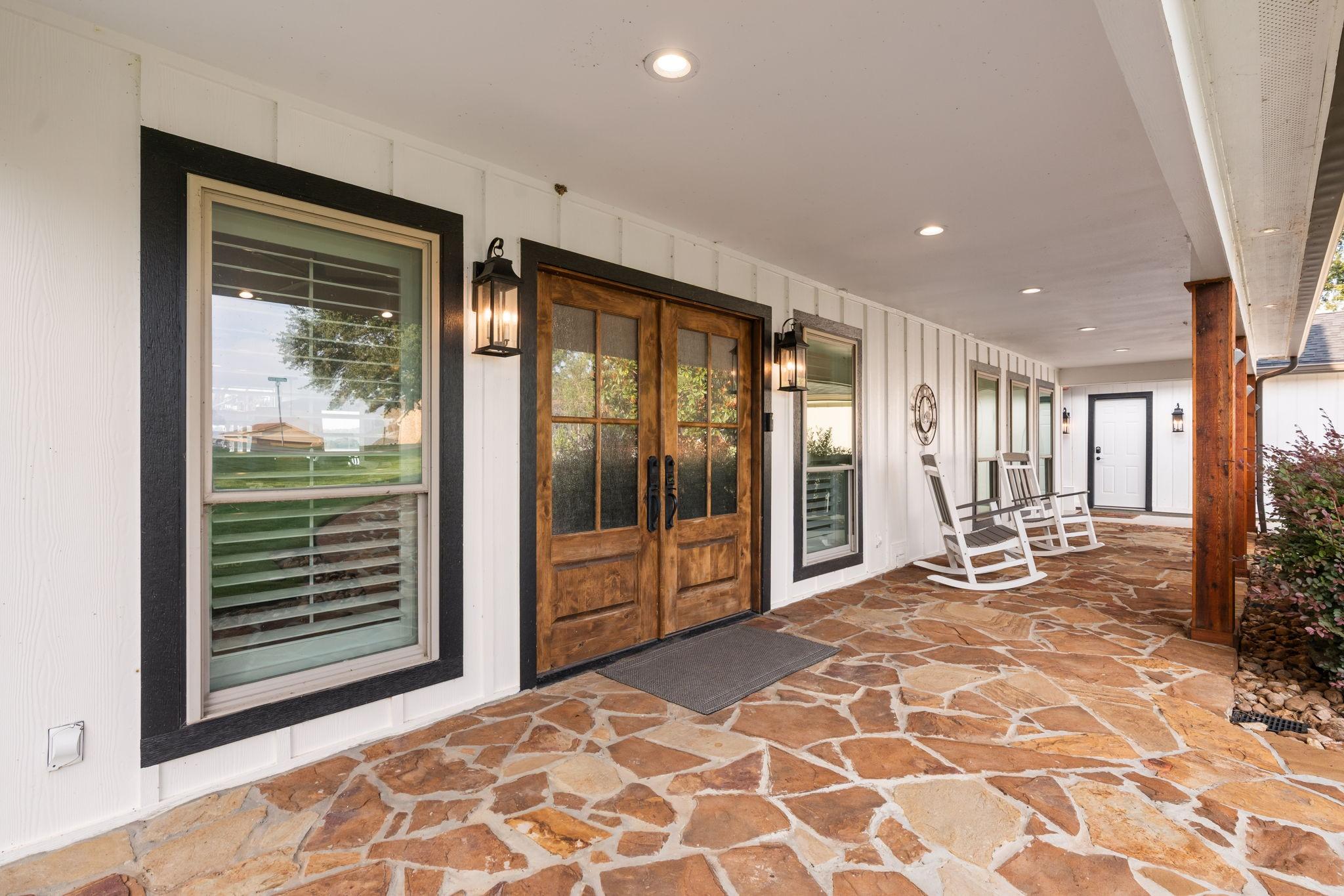 Image 4: The expansive covered front porch greets all upon