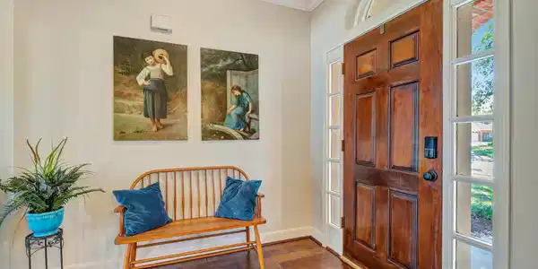 Image 3: Inviting entryway featuring a beautiful wooden fro